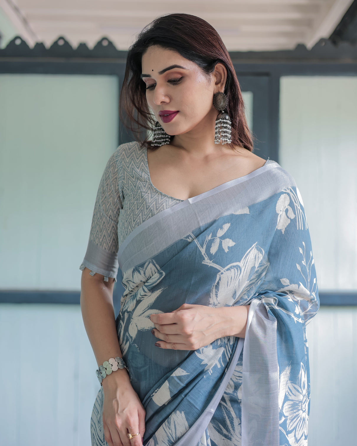 Pastel blue floral and geometric printed cotton linen saree with blouse and tassel edges