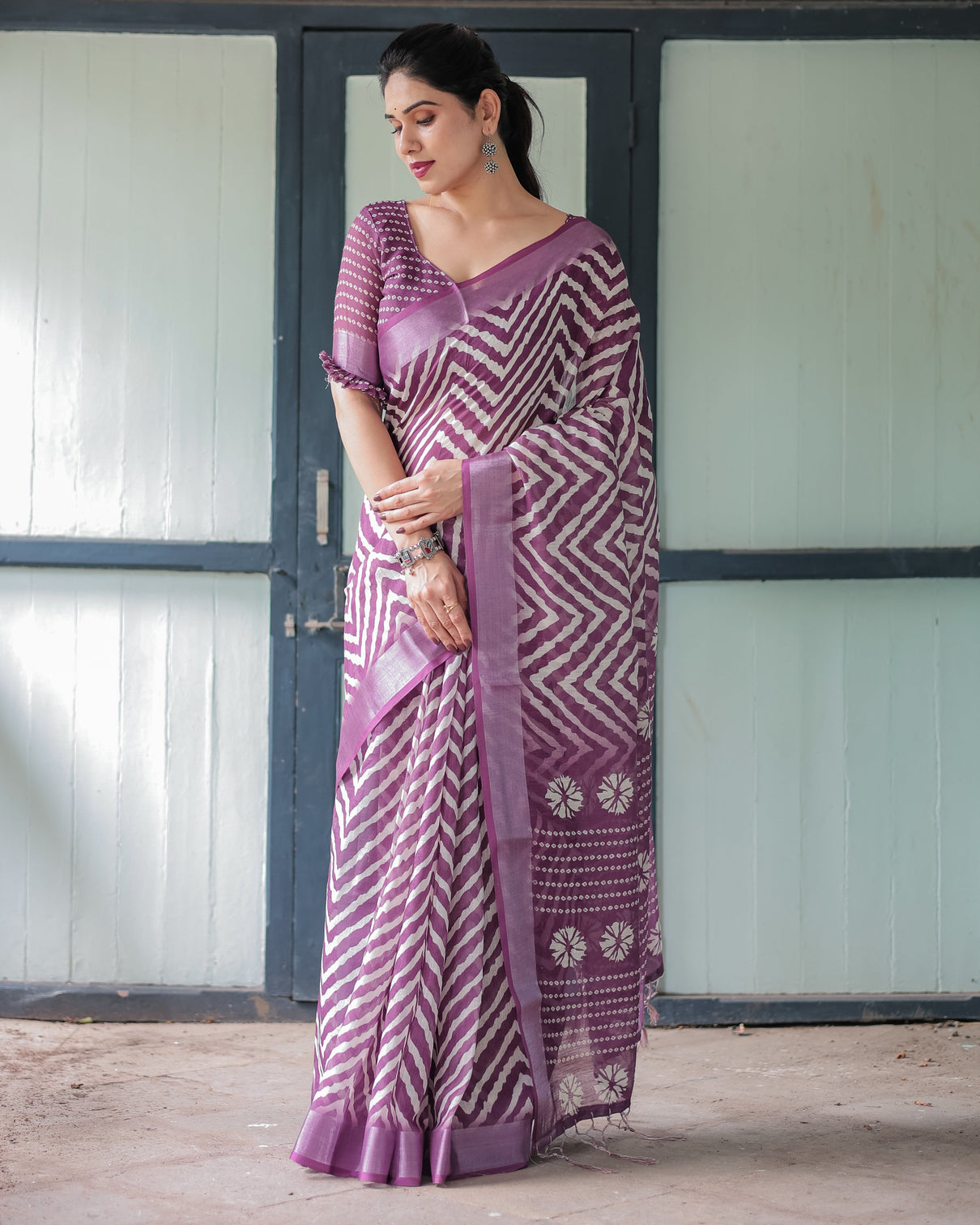Purple and white zigzag patterned pure cotton linen saree with blouse and tassel edges