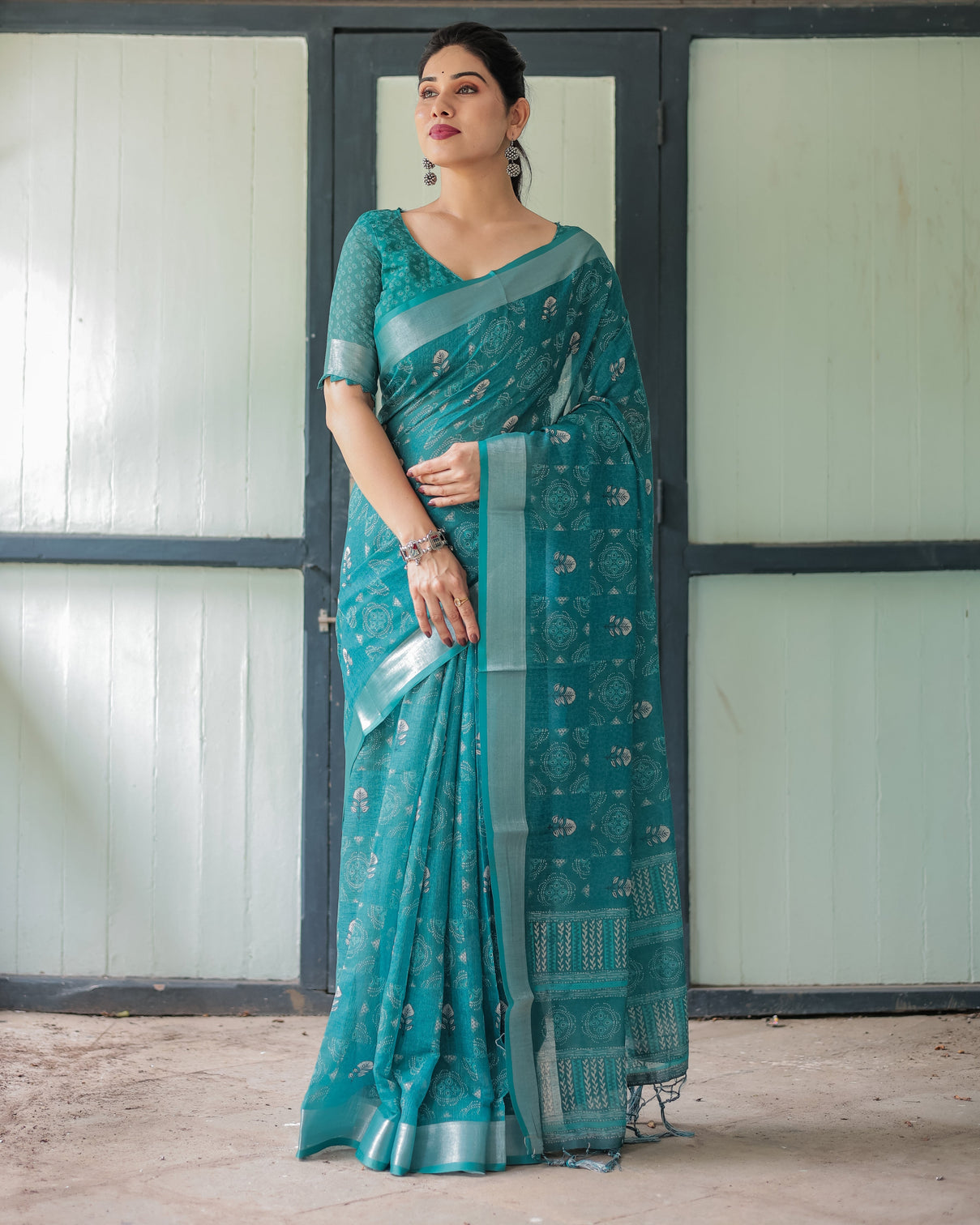 Teal green pure cotton linen saree with silver floral motifs and tassels mameraa