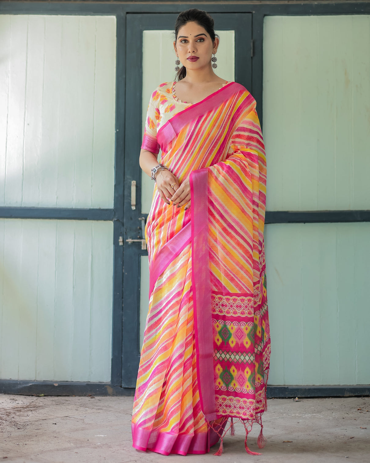 Vibrant yellow and pink ikat printed cotton linen saree with blouse and tassels mameraa