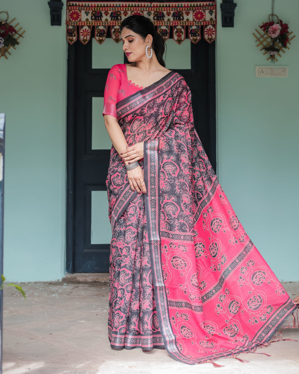 Pure cotton linen saree in black and pink with floral print and tassels