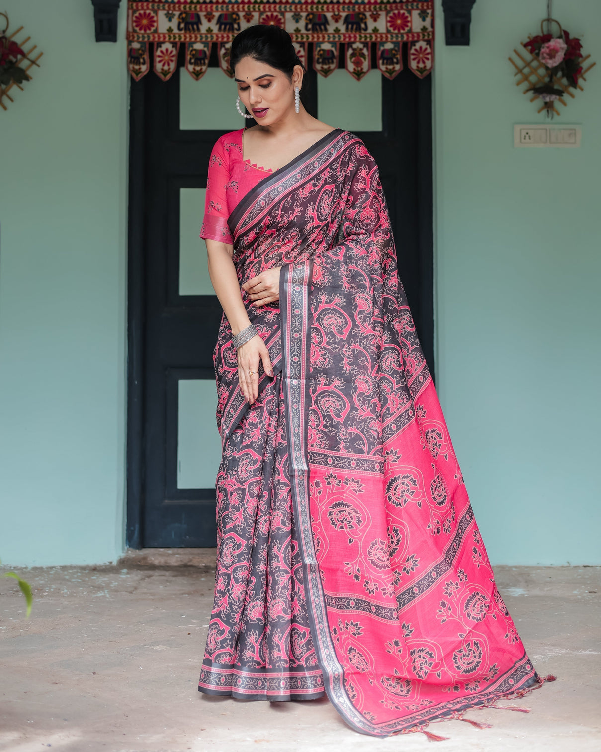 Pure cotton linen saree in black and pink with floral print and tassels