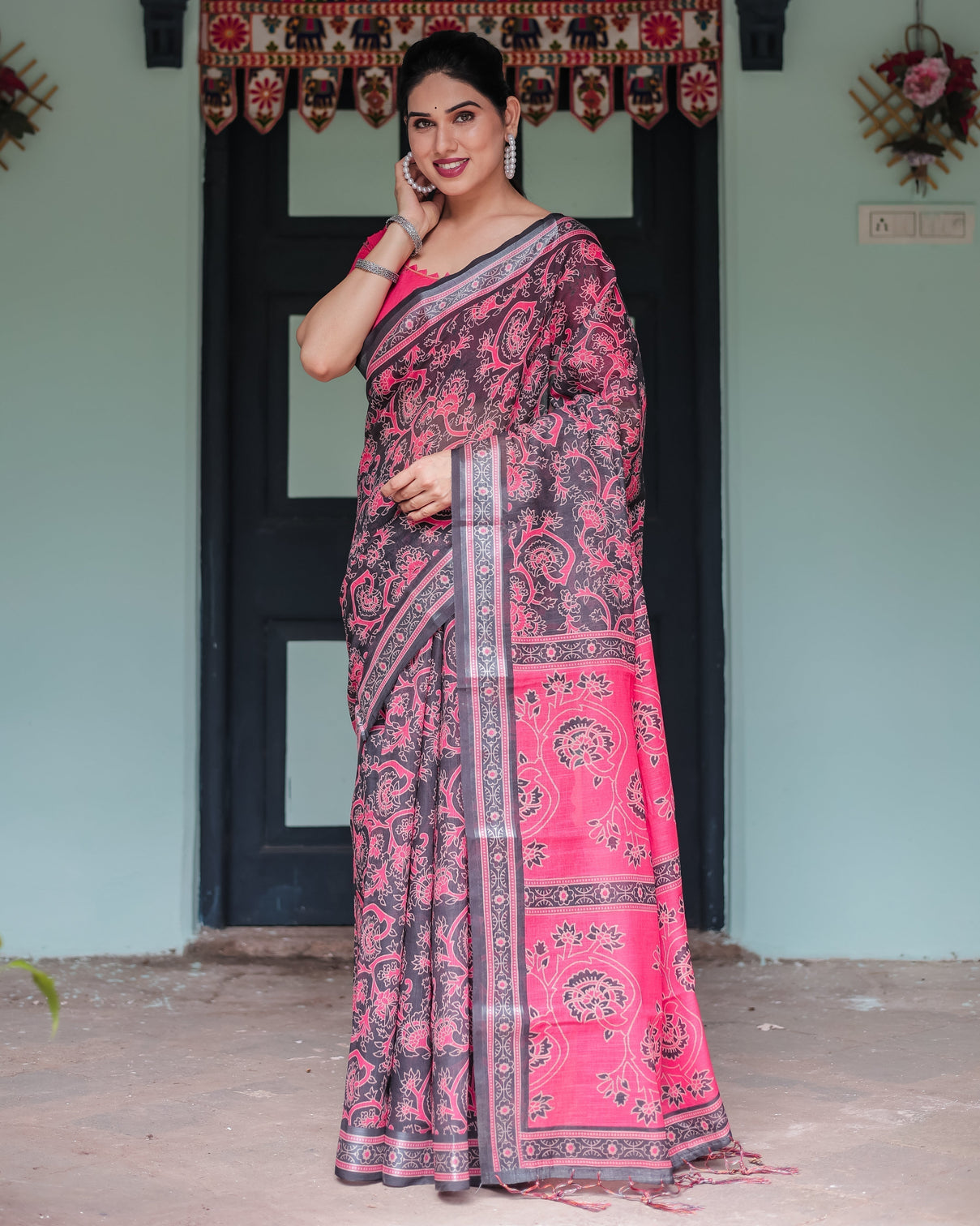Pure cotton linen saree in black and pink with floral print and tassels