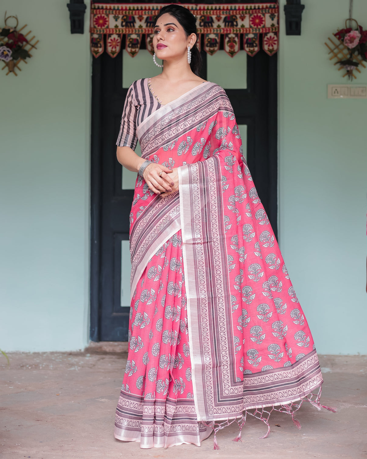 Pink and beige floral printed pure cotton linen saree with striped blouse and tassels on edges