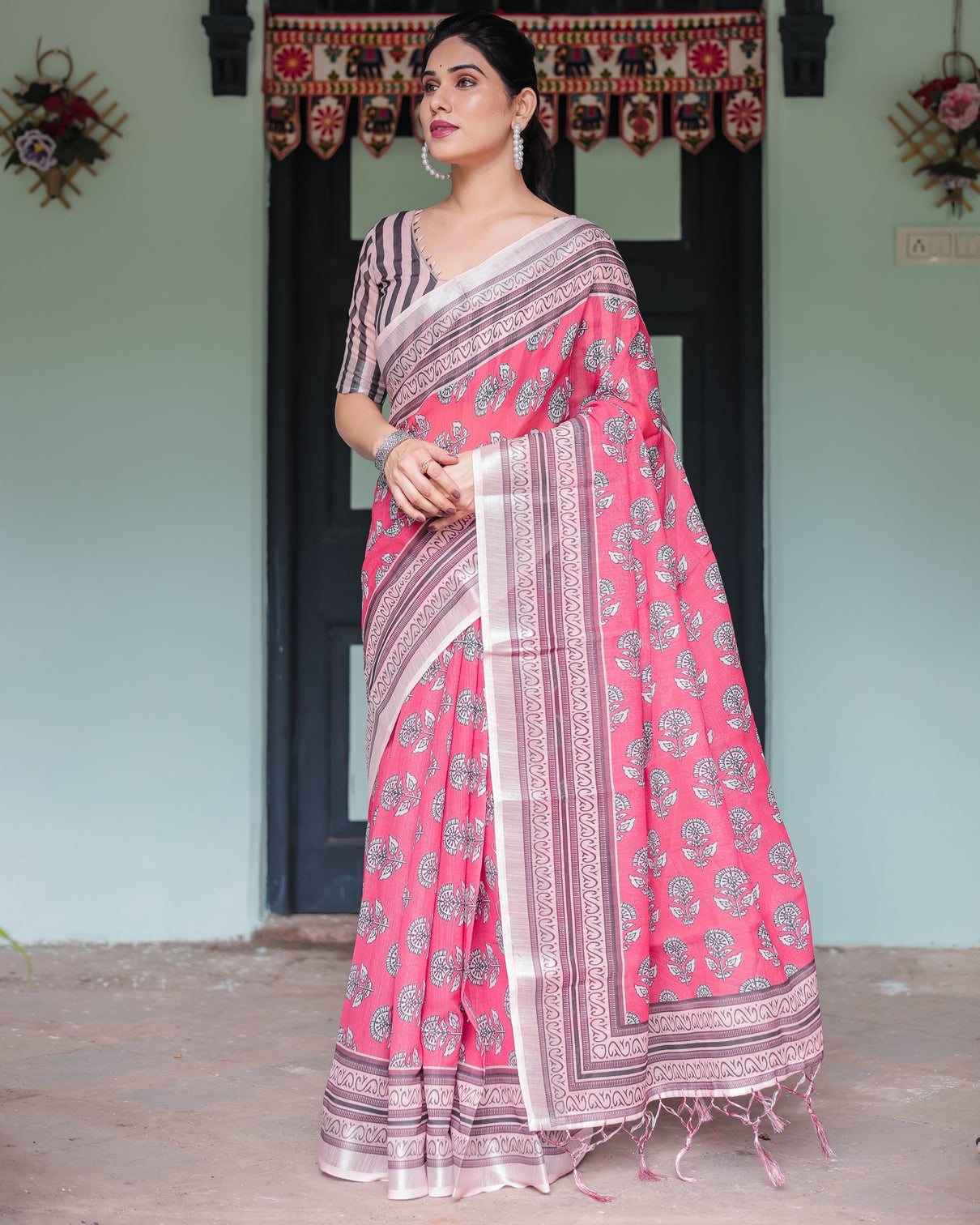 Pink and beige floral printed pure cotton linen saree with striped blouse and tassels on edges