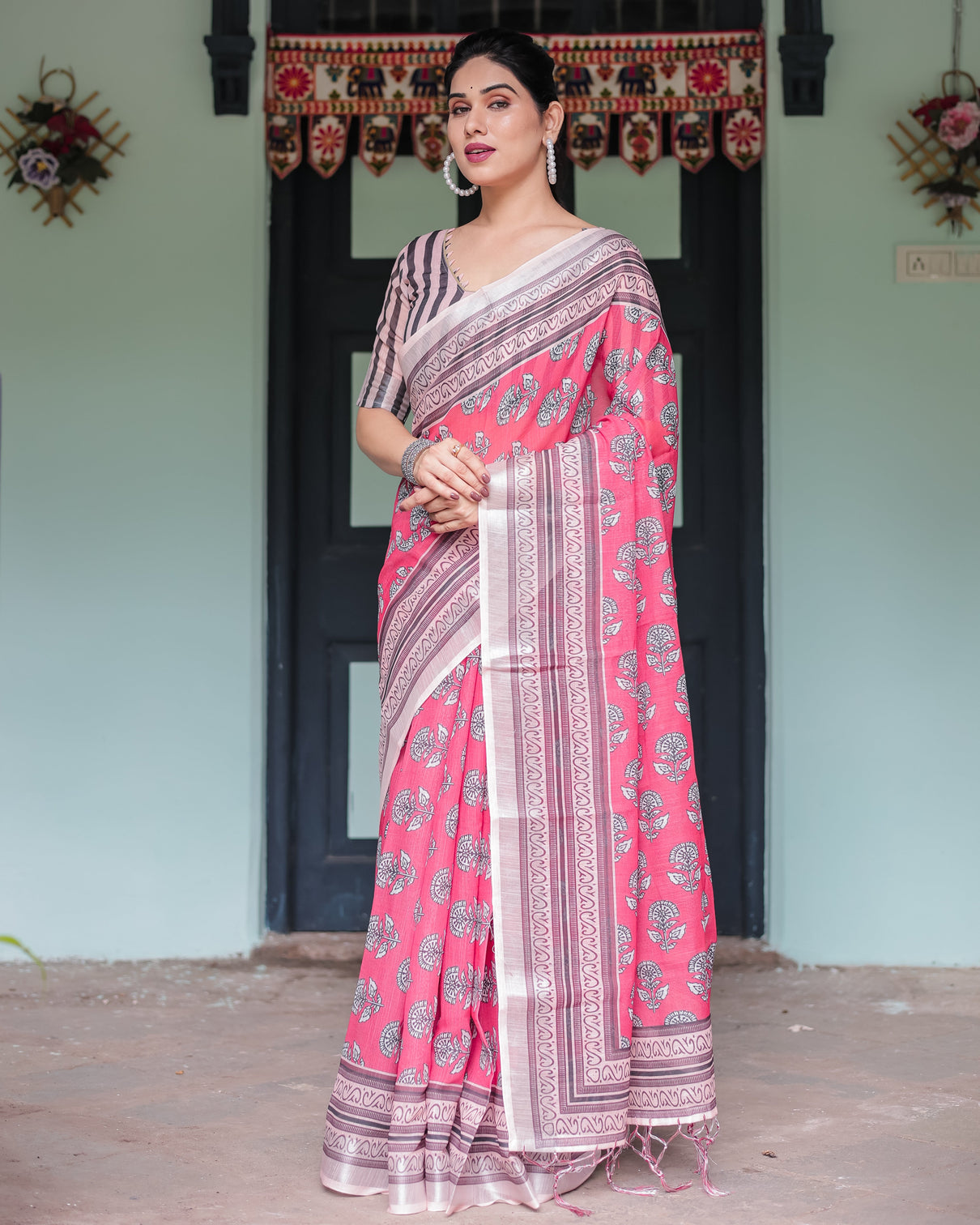 Pink and beige floral printed pure cotton linen saree with striped blouse and tassels on edges