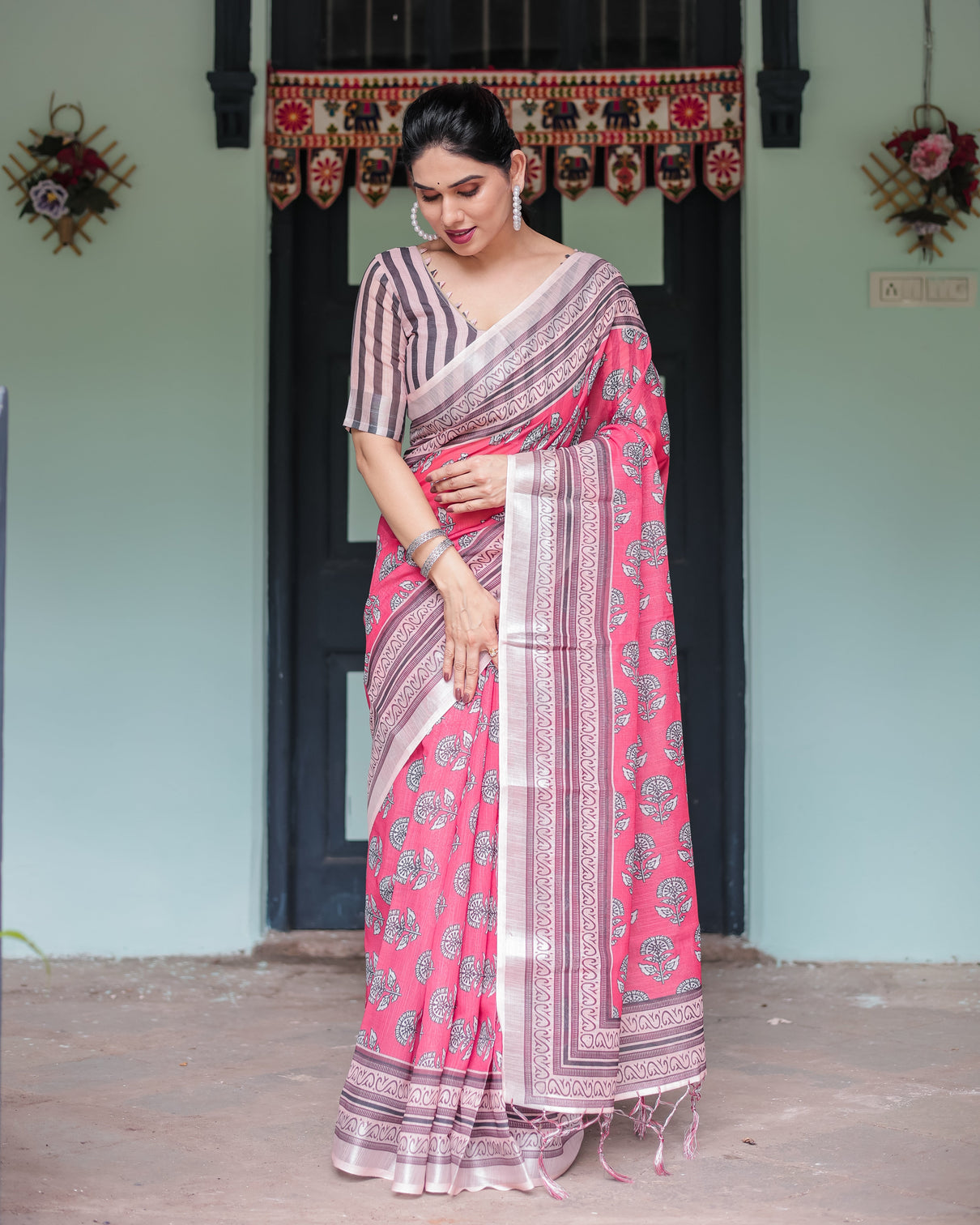 Pink and beige floral printed pure cotton linen saree with striped blouse and tassels on edges