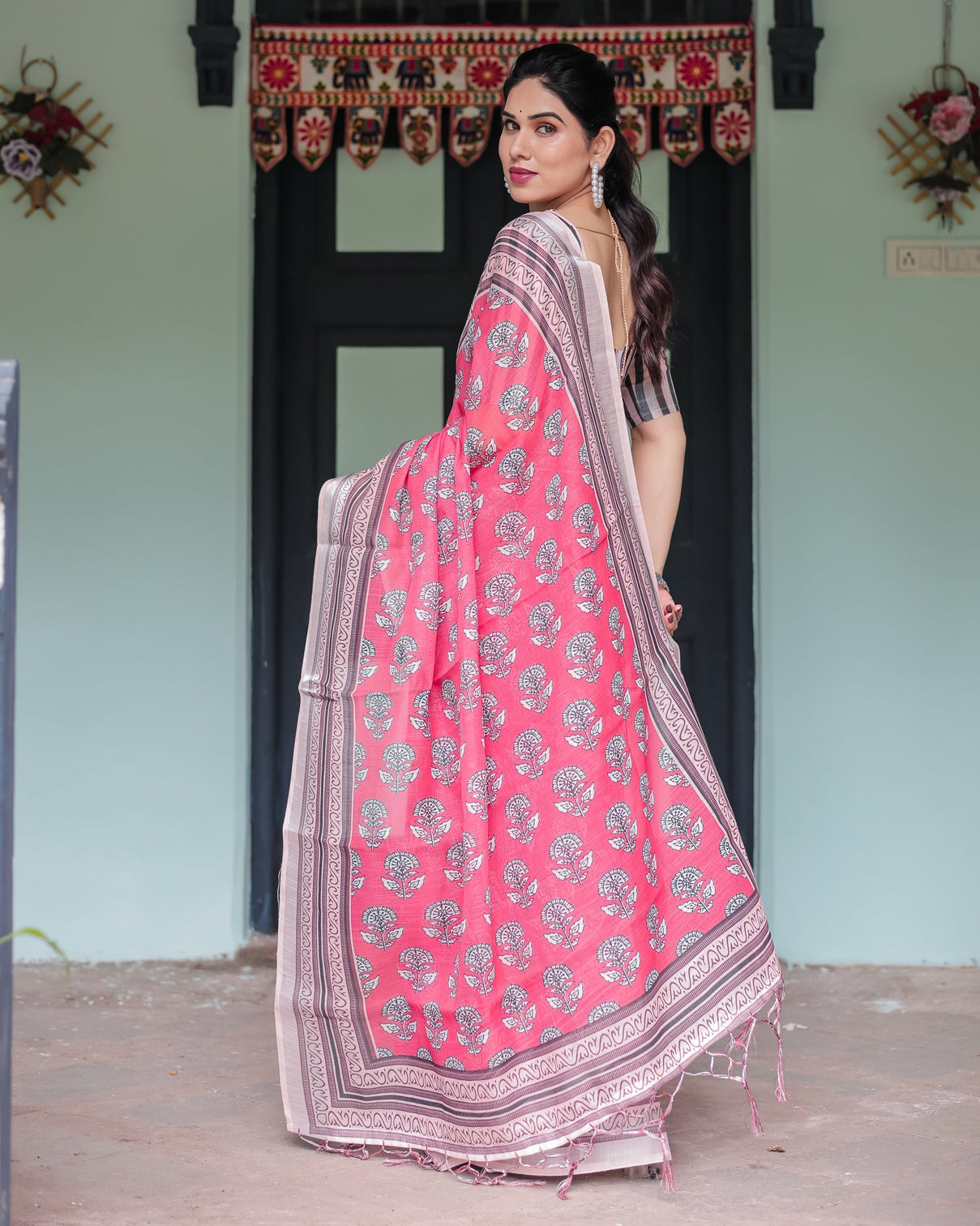 Pink and beige floral printed pure cotton linen saree with striped blouse and tassels on edges