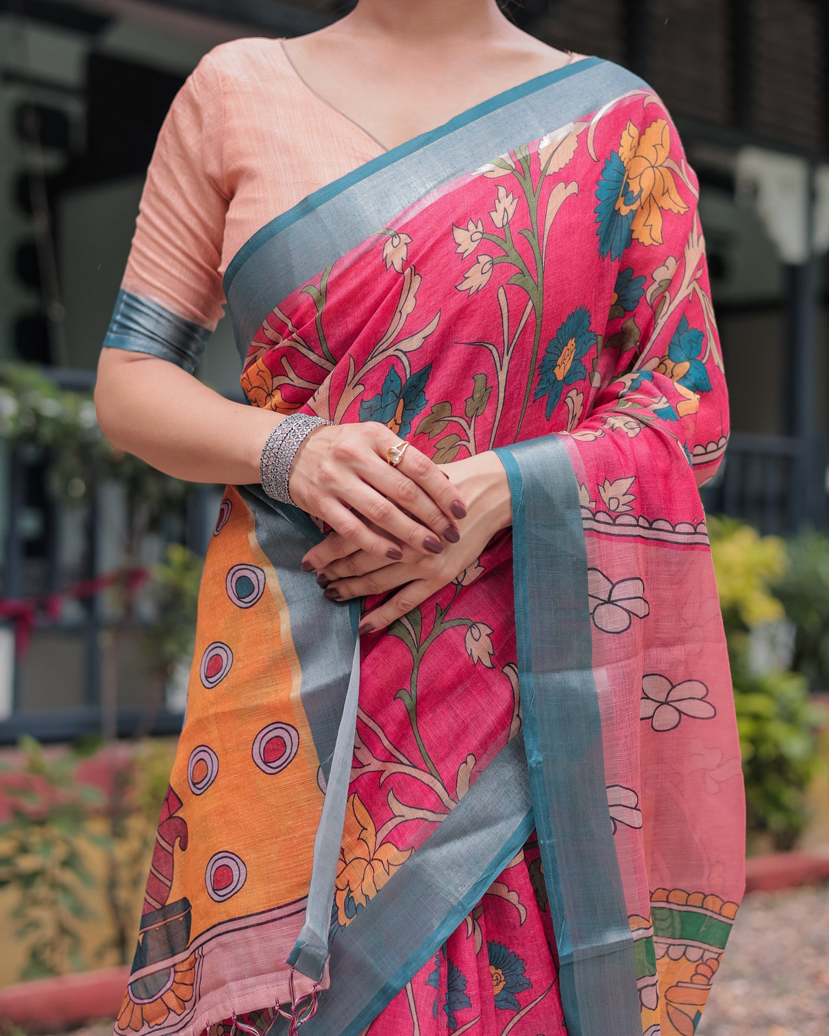 Pink and orange pure cotton linen saree with floral kalamkari print blue border and tassels