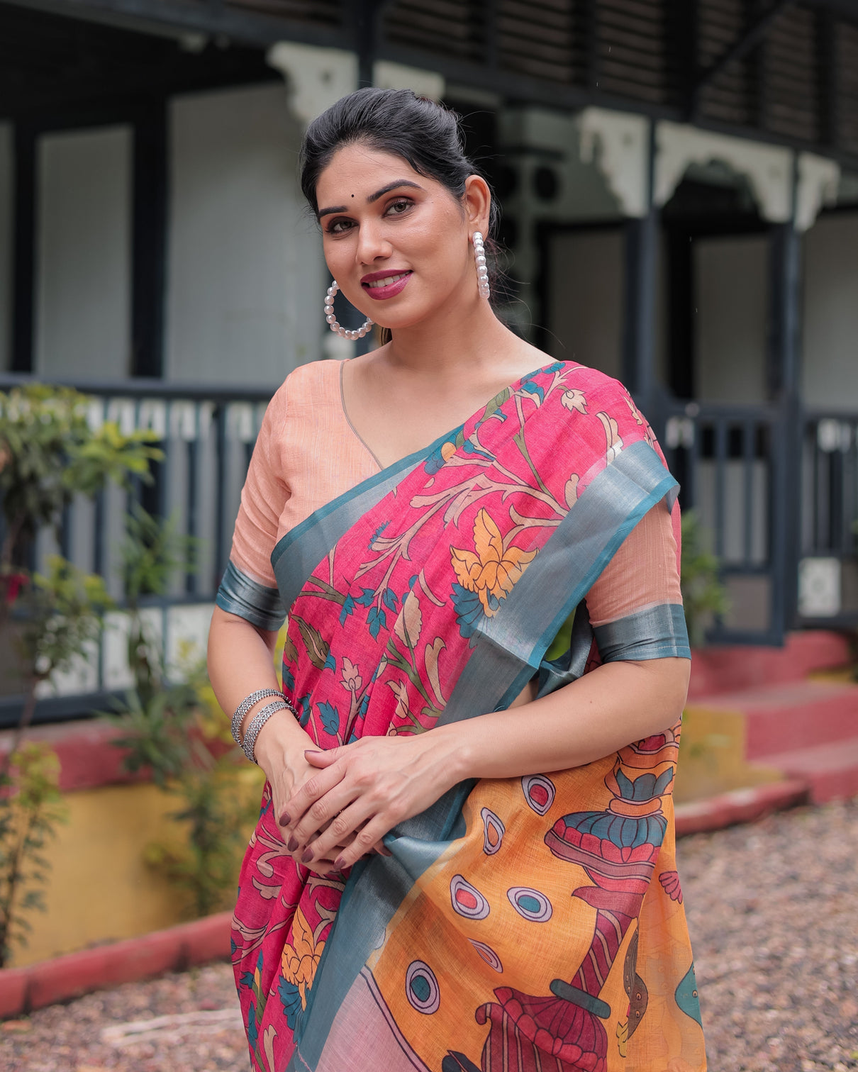 Pink and orange pure cotton linen saree with floral kalamkari print blue border and tassels