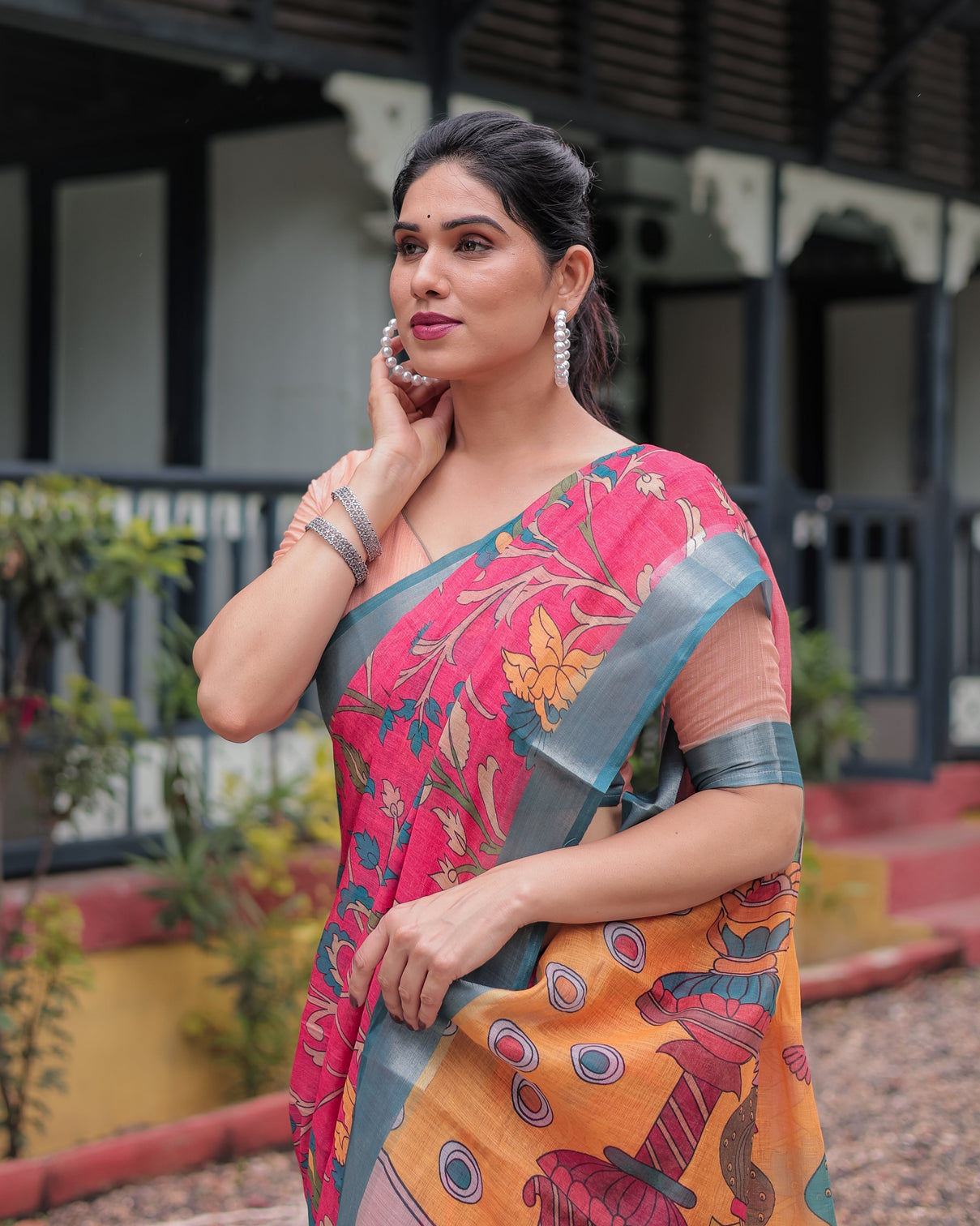 Pink and orange pure cotton linen saree with floral kalamkari print blue border and tassels