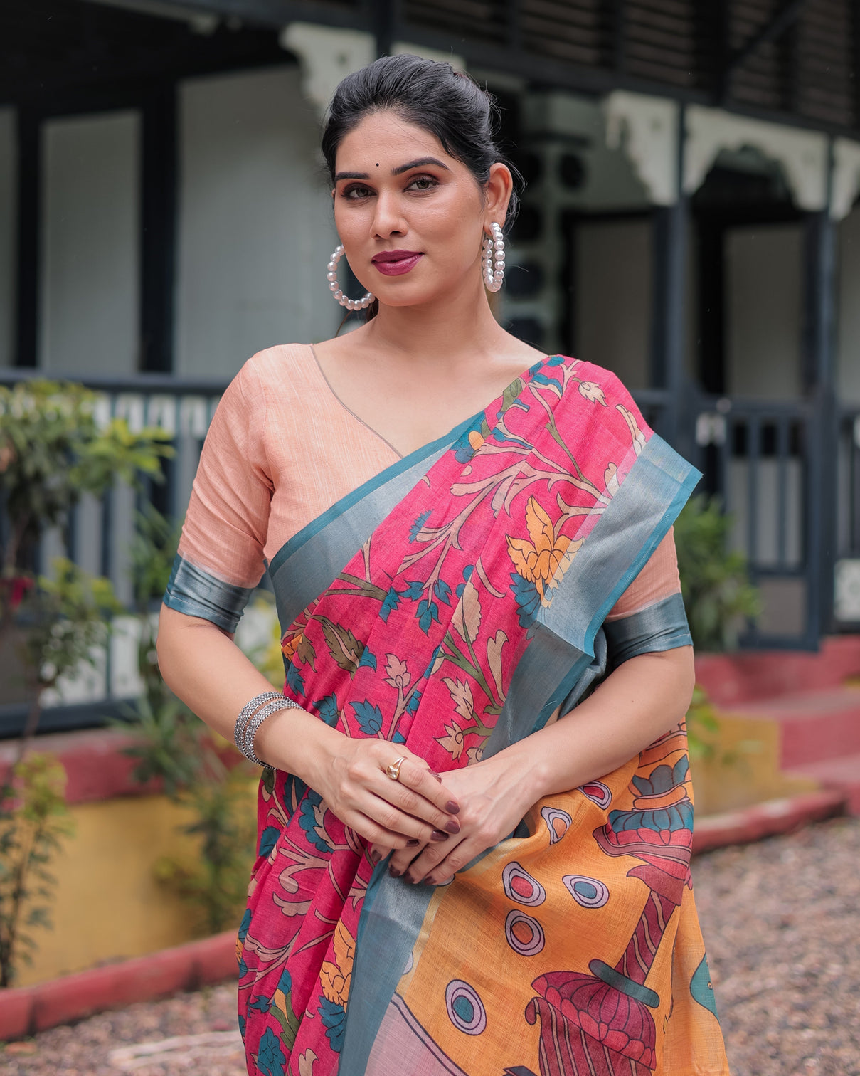 Pink and orange pure cotton linen saree with floral kalamkari print blue border and tassels