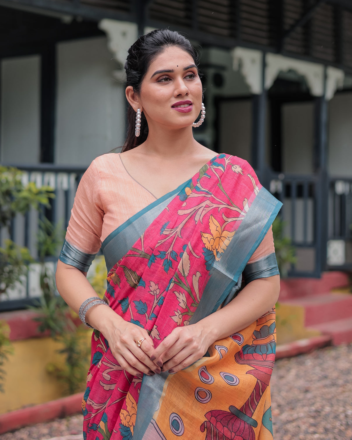 Pink and orange pure cotton linen saree with floral kalamkari print blue border and tassels