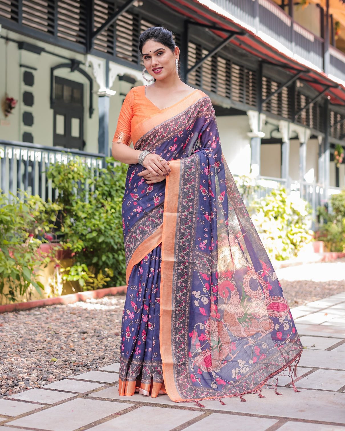 Indigo blue floral print pure cotton linen saree with orange border and tassels