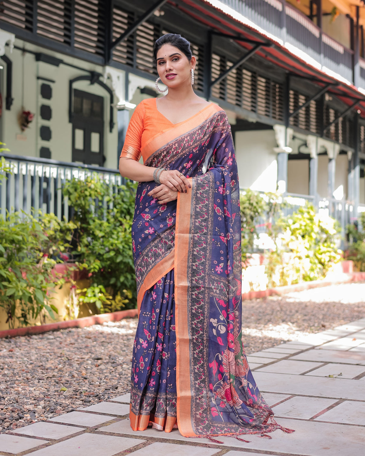 Indigo blue floral print pure cotton linen saree with orange border and tassels