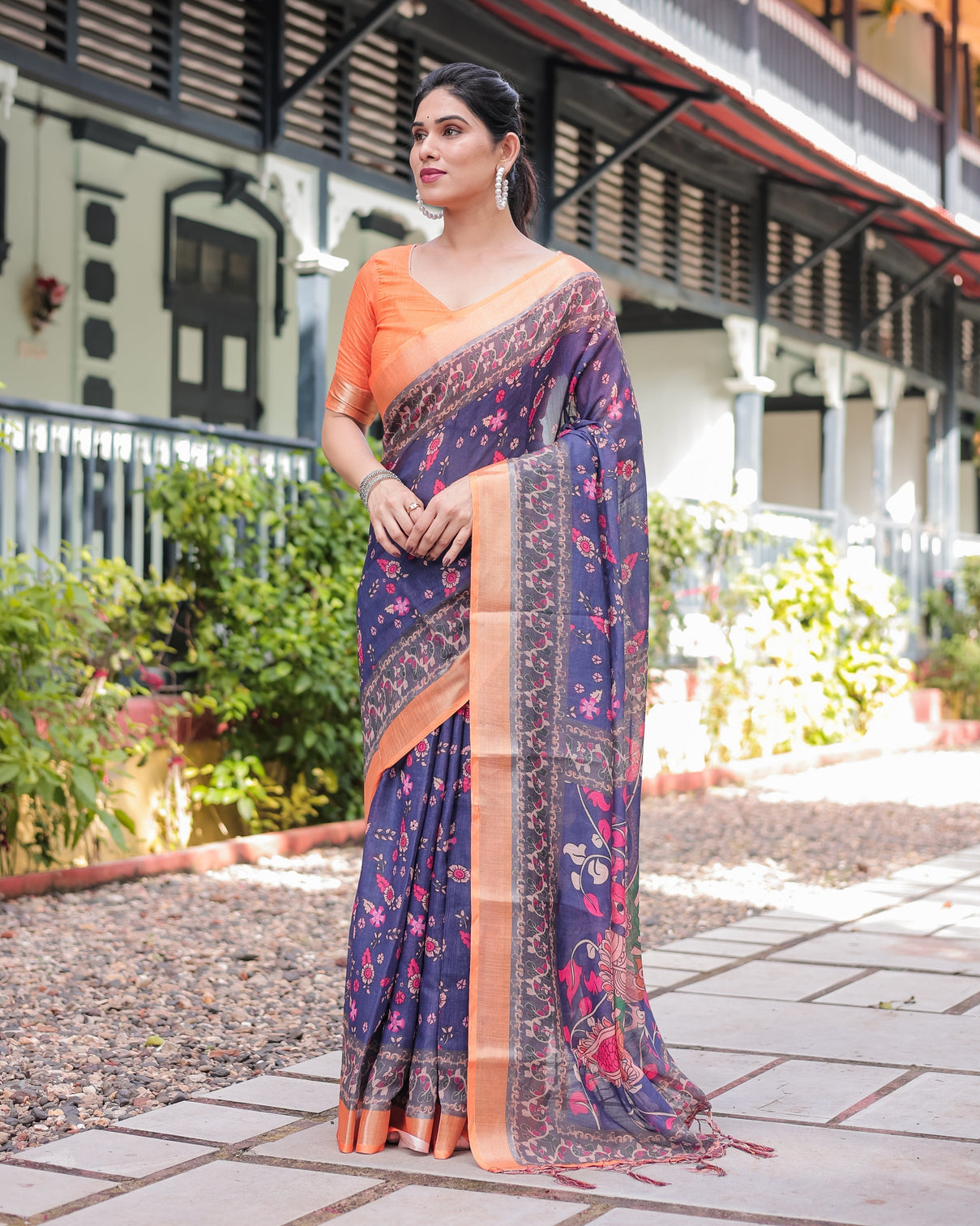 Indigo blue floral print pure cotton linen saree with orange border and tassels