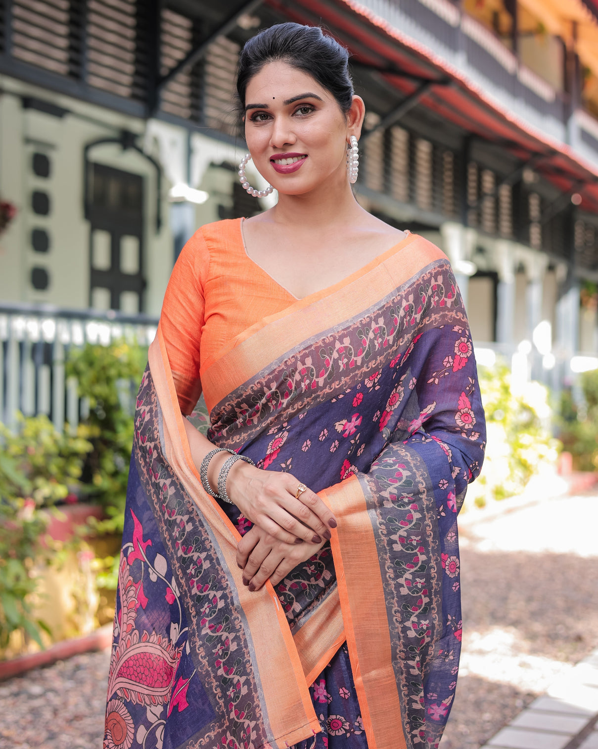 Indigo blue floral print pure cotton linen saree with orange border and tassels