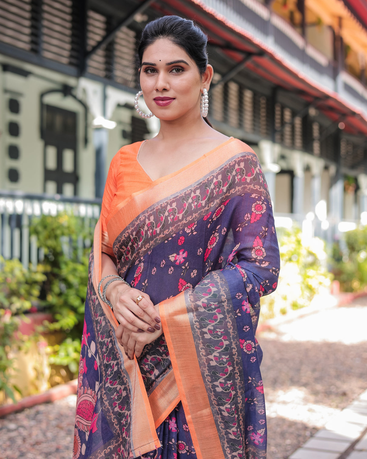 Indigo blue floral print pure cotton linen saree with orange border and tassels