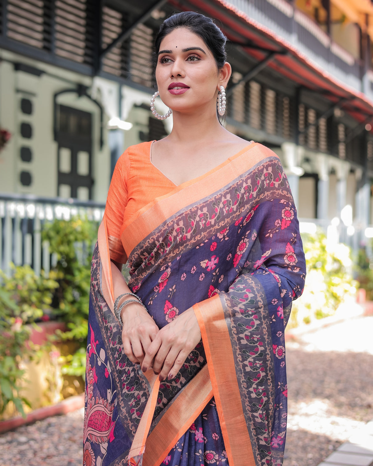 Indigo blue floral print pure cotton linen saree with orange border and tassels