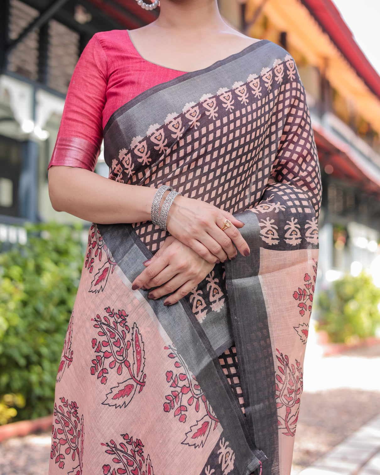 Peach and black floral and geometric design pure cotton linen saree with blouse and tassels