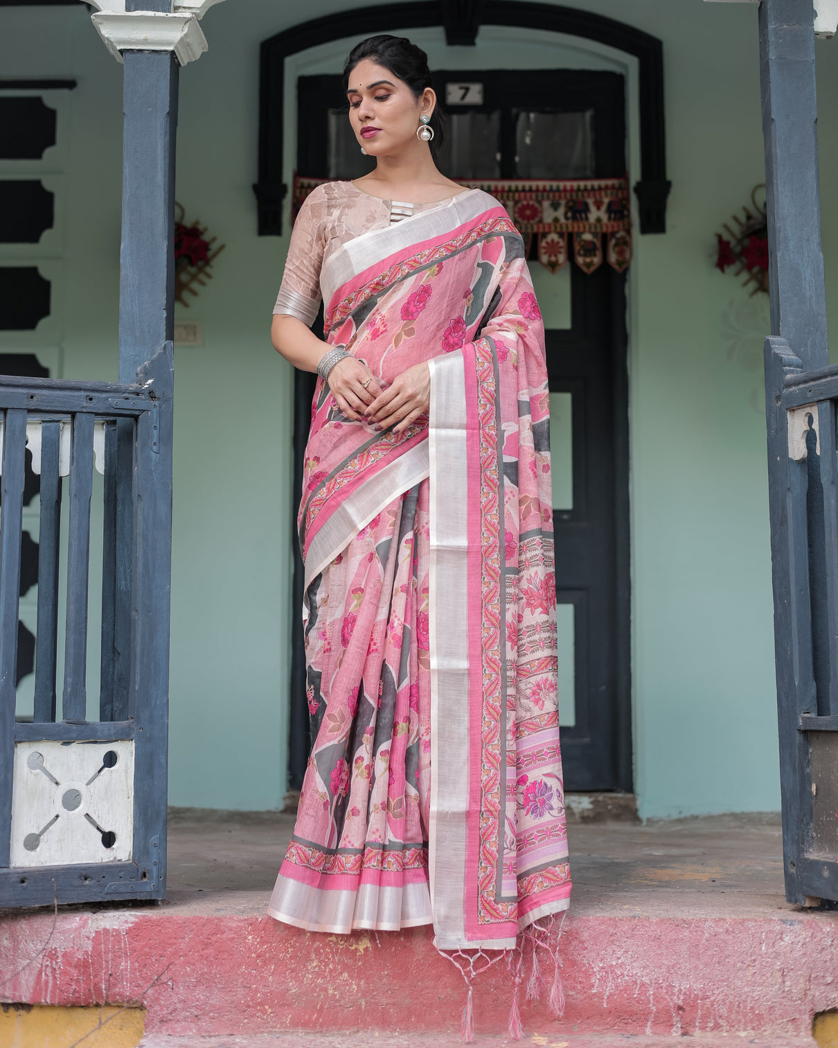 Elegant pink and white pure cotton linen saree with floral and foliage prints contrast border and tassels