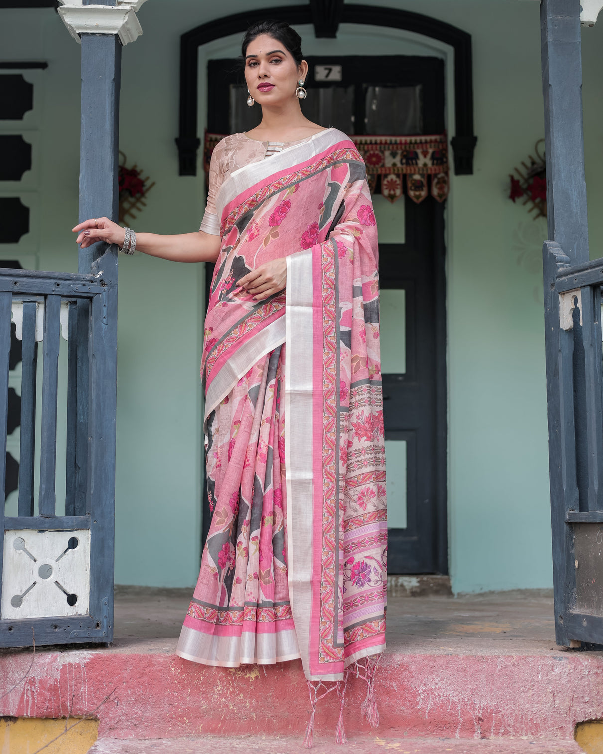 Elegant pink and white pure cotton linen saree with floral and foliage prints contrast border and tassels