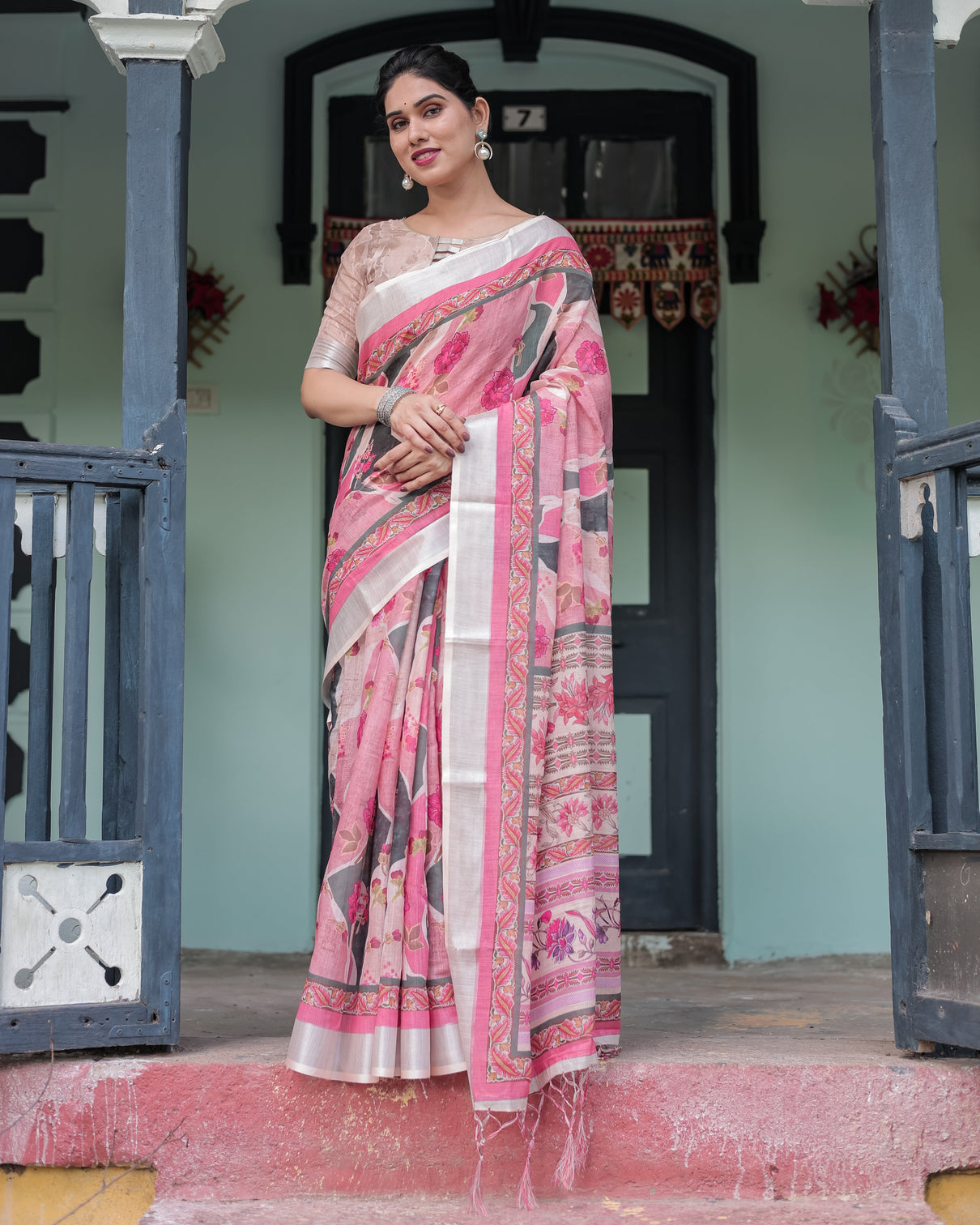 Elegant pink and white pure cotton linen saree with floral and foliage prints contrast border and tassels