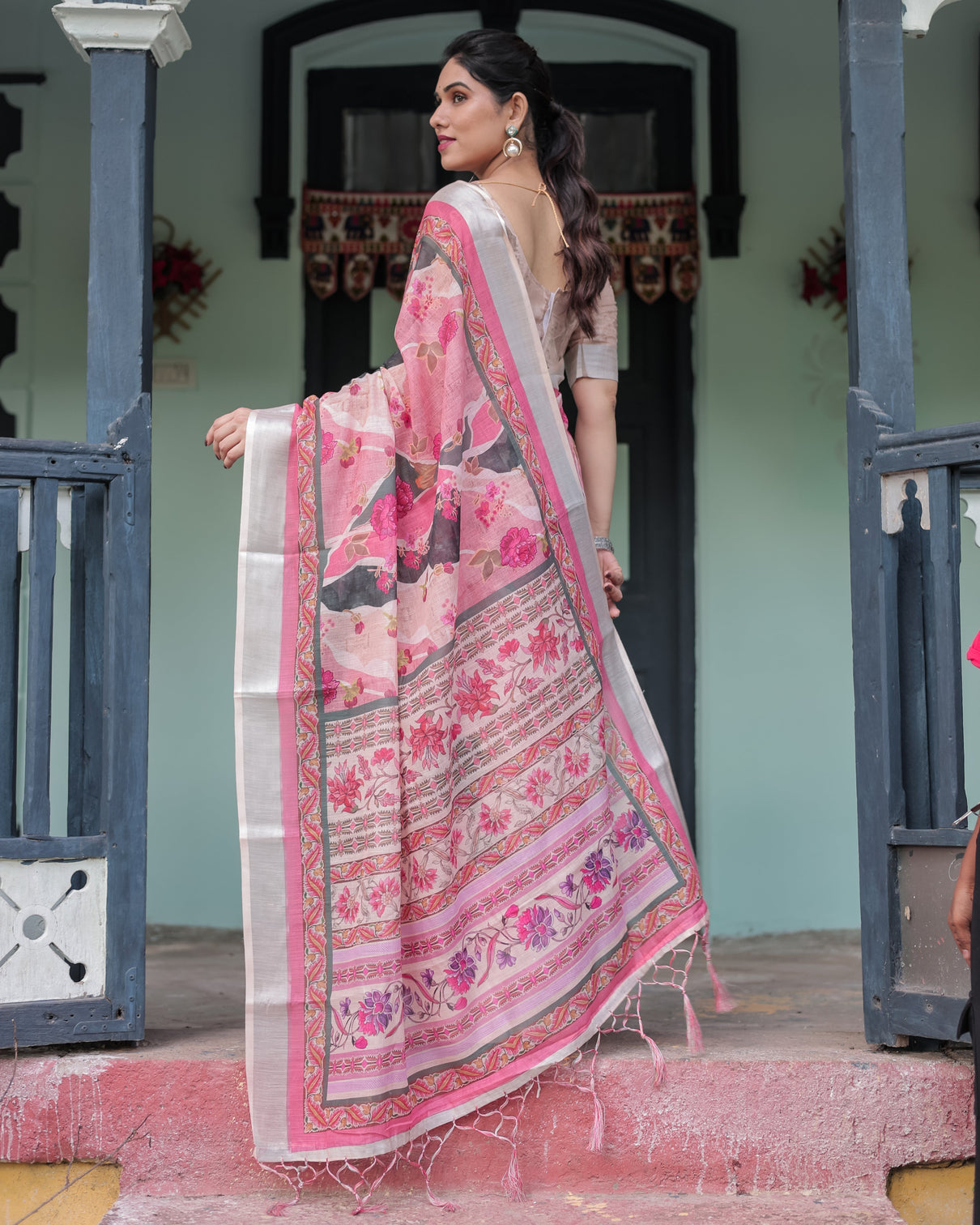 Elegant pink and white pure cotton linen saree with floral and foliage prints contrast border and tassels