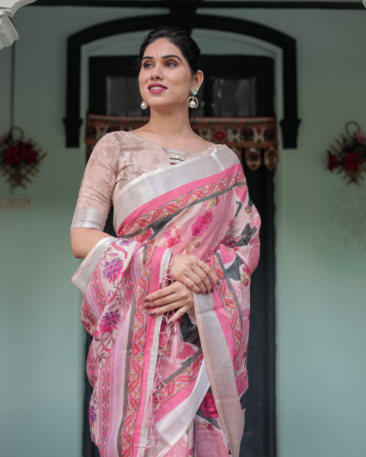 Elegant pink and white pure cotton linen saree with floral and foliage prints contrast border and tassels