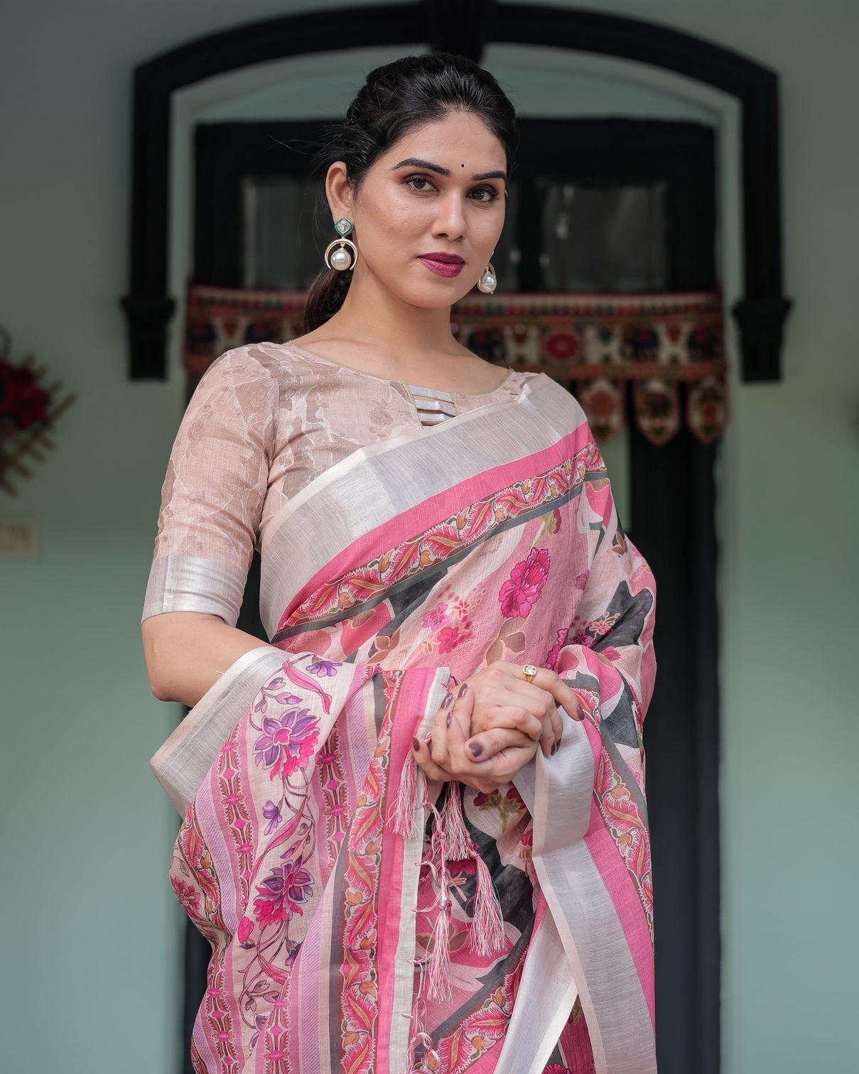 Elegant pink and white pure cotton linen saree with floral and foliage prints contrast border and tassels