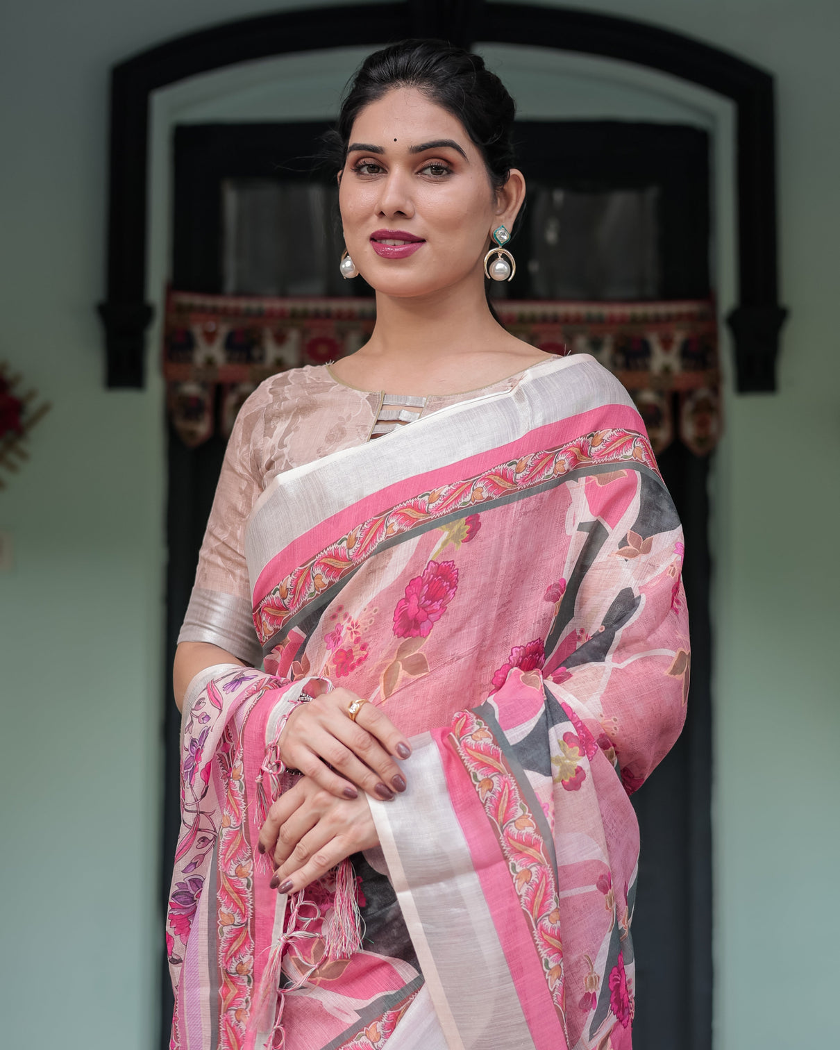 Elegant pink and white pure cotton linen saree with floral and foliage prints contrast border and tassels