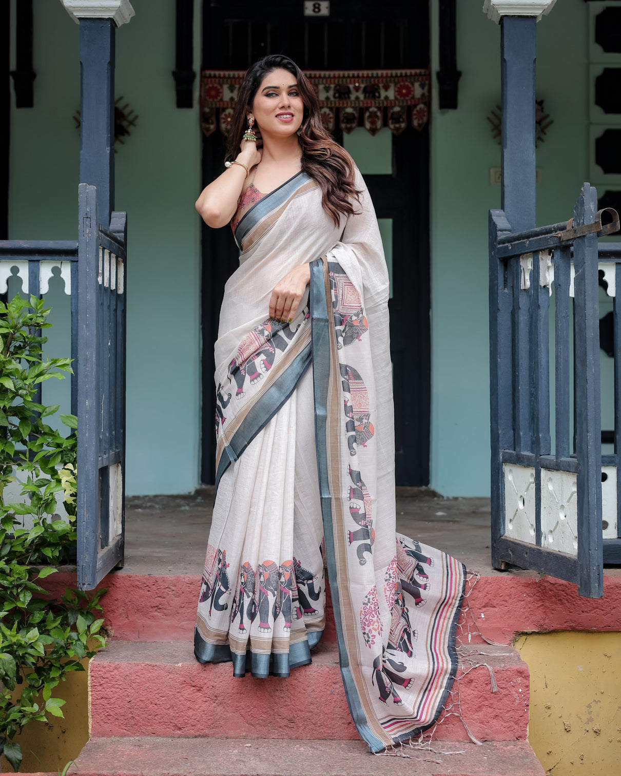 Ivory pure cotton linen saree with elephant motif and tassel detailing