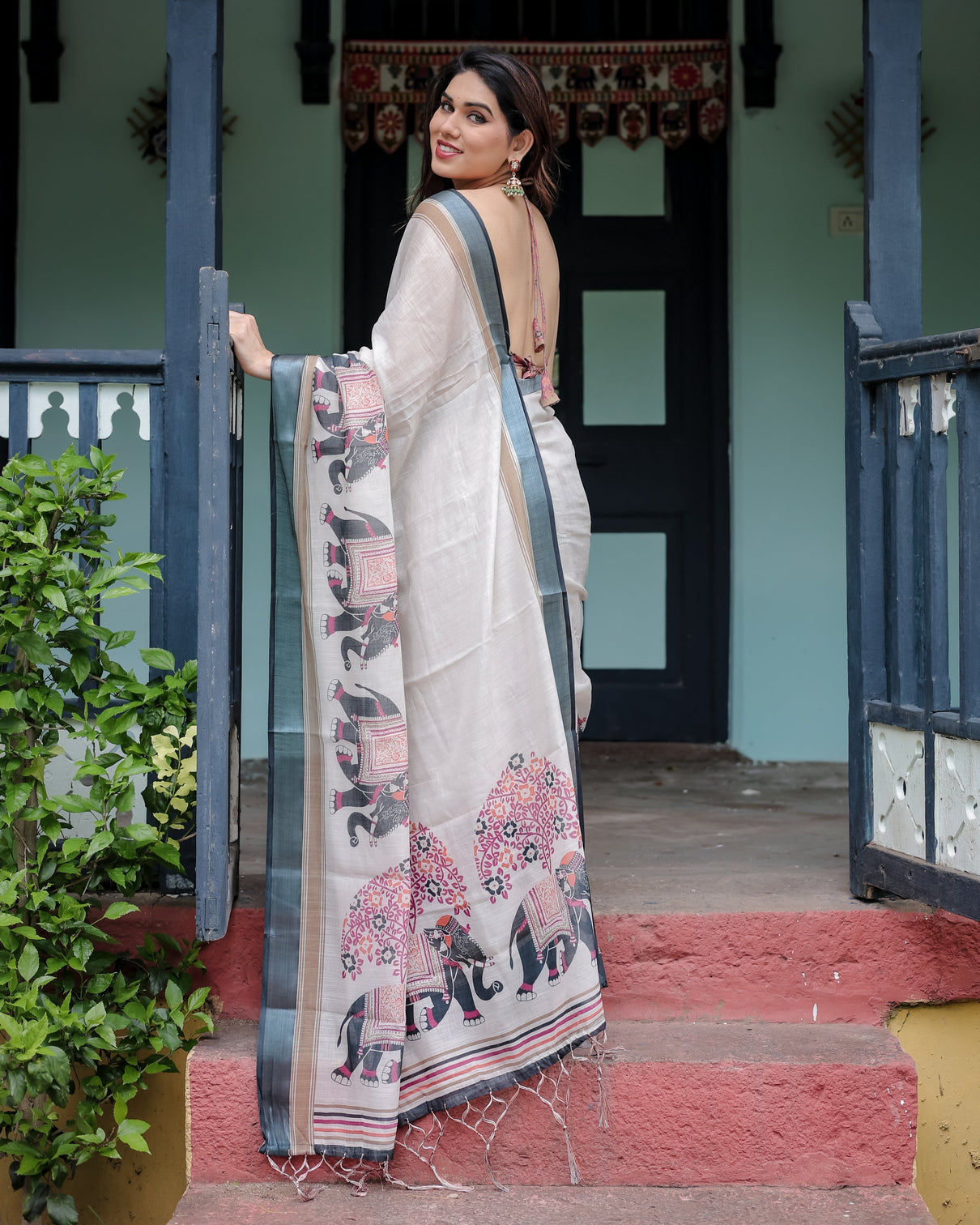 Ivory pure cotton linen saree with elephant motif and tassel detailing