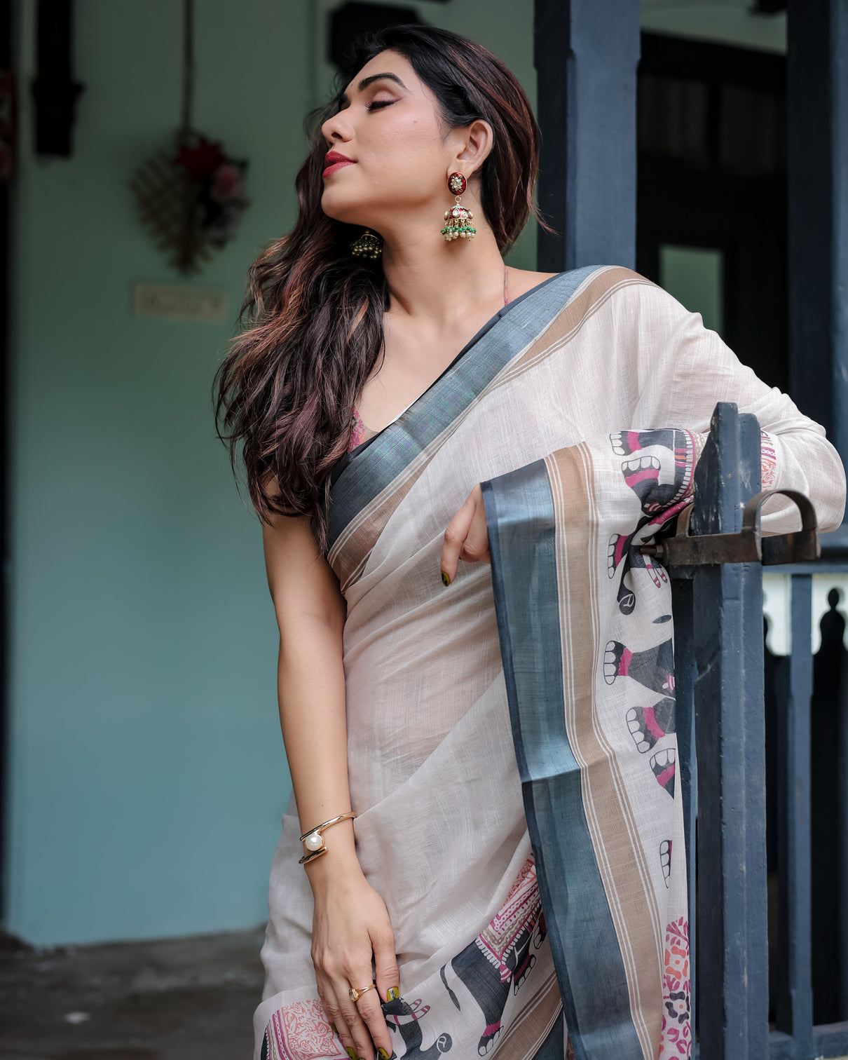 Ivory pure cotton linen saree with elephant motif and tassel detailing