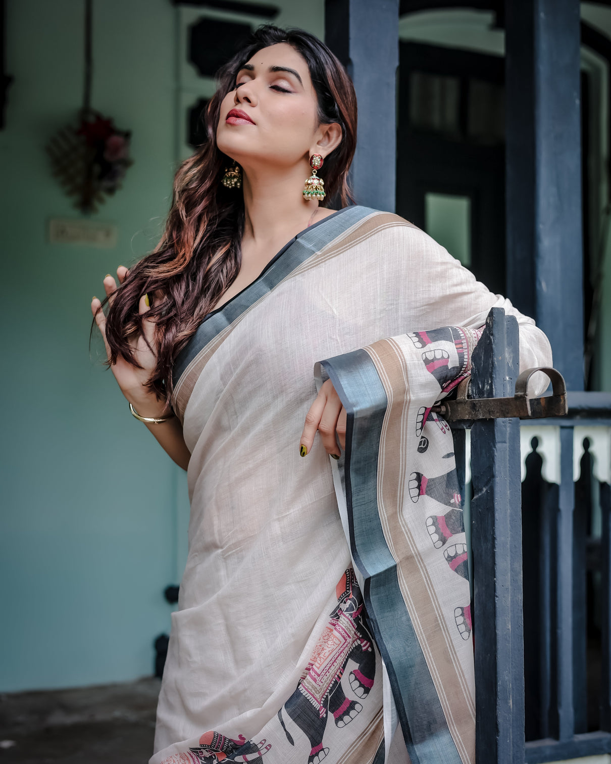 Ivory pure cotton linen saree with elephant motif and tassel detailing