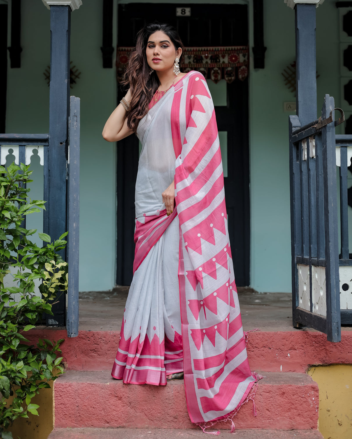 White and pink pure cotton linen saree with geometric stripes blouse and tassel detailing