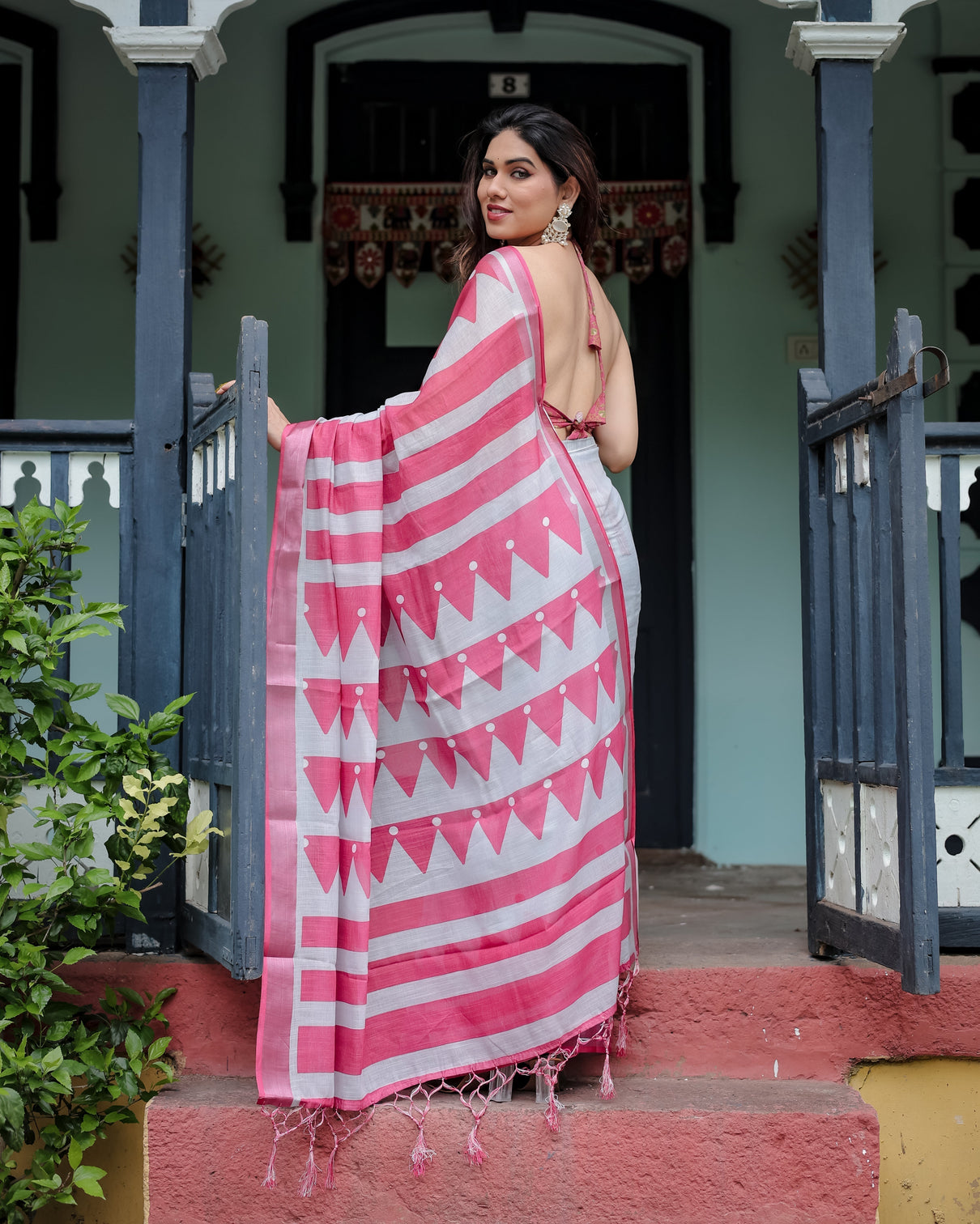 White and pink pure cotton linen saree with geometric stripes blouse and tassel detailing