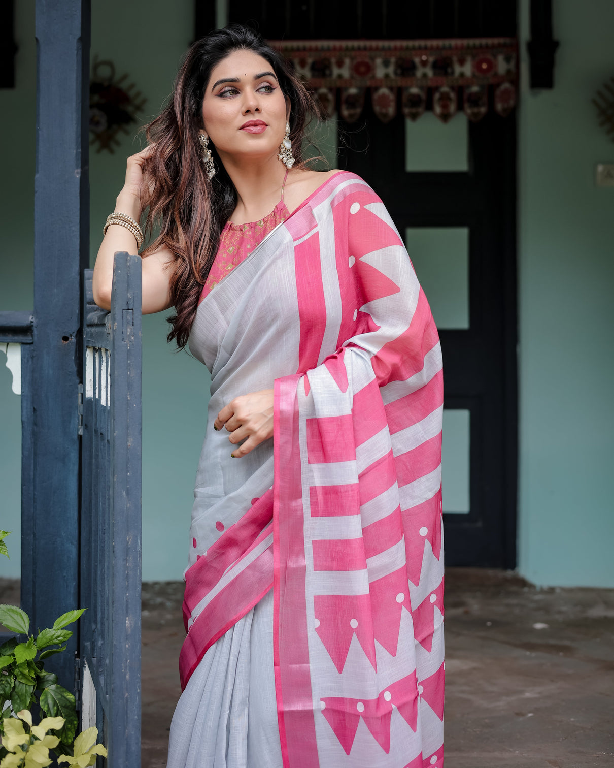 White and pink pure cotton linen saree with geometric stripes blouse and tassel detailing