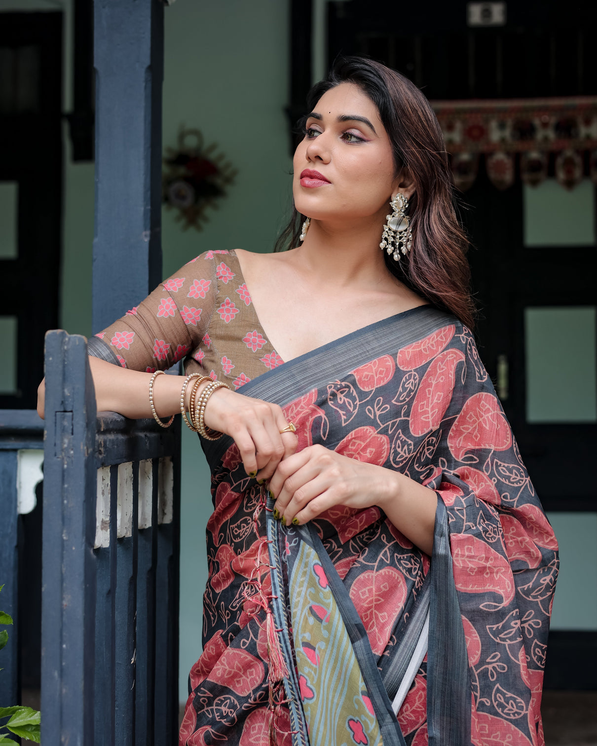 Charcoal black pure cotton linen saree with leafy paisley print blouse and tassel detailing