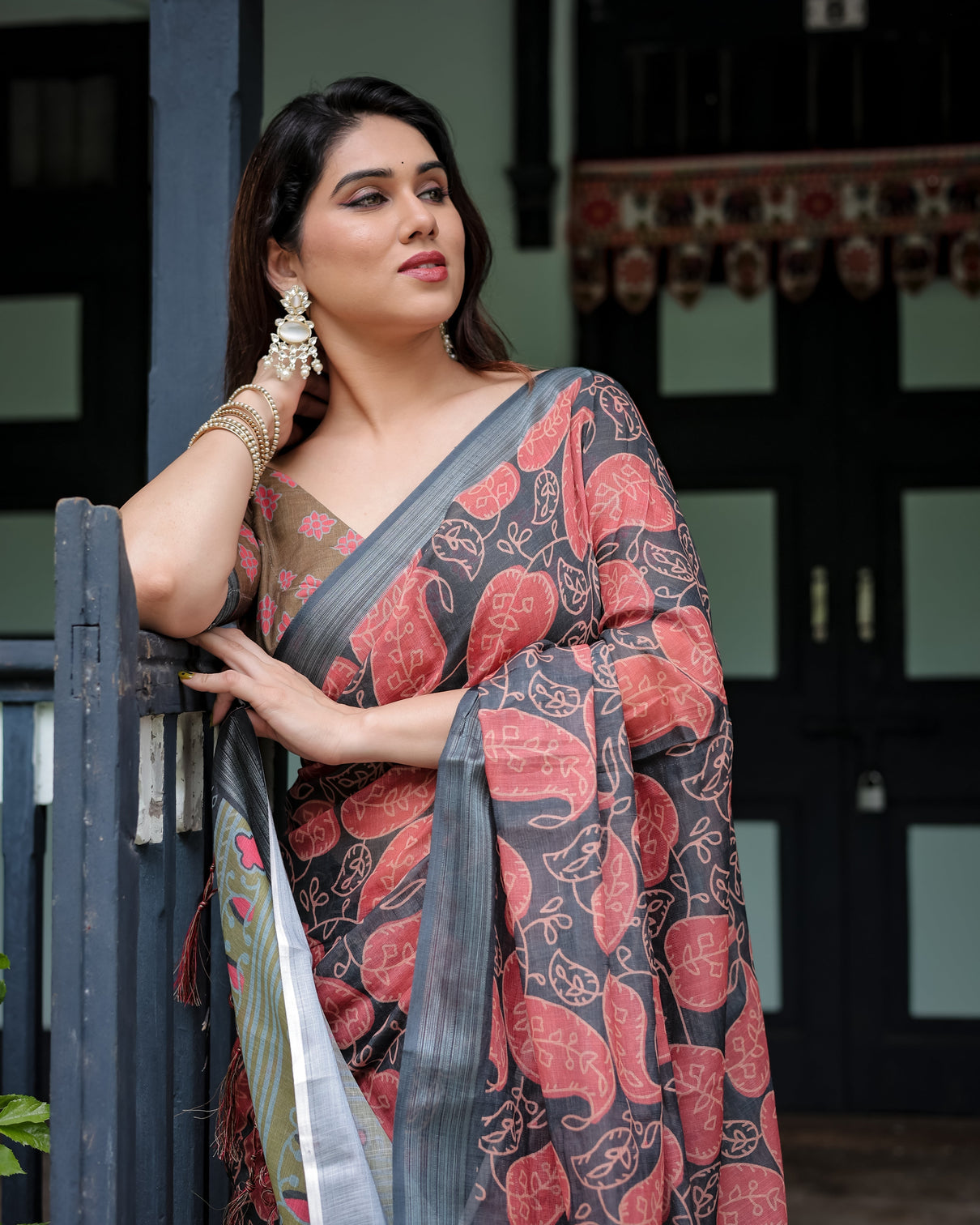 Charcoal black pure cotton linen saree with leafy paisley print blouse and tassel detailing