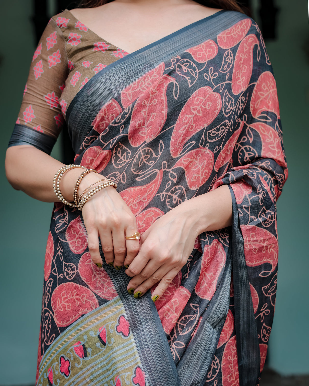 Charcoal black pure cotton linen saree with leafy paisley print blouse and tassel detailing