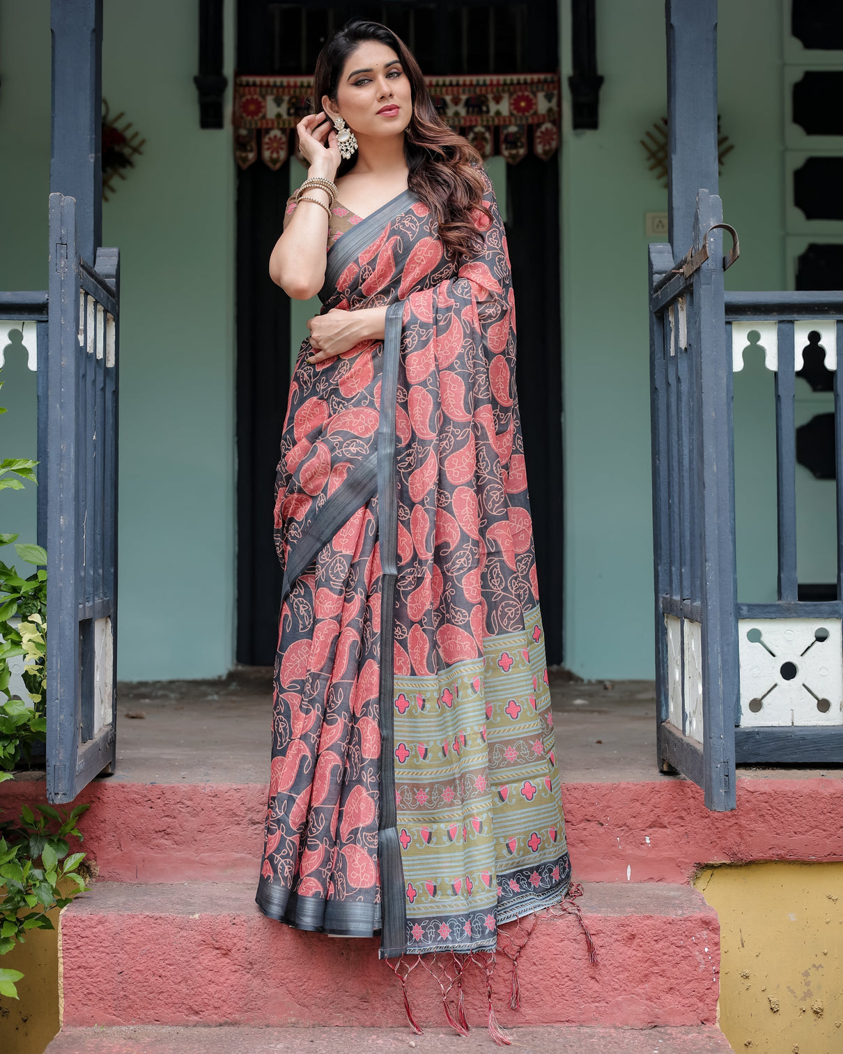 Charcoal black pure cotton linen saree with leafy paisley print blouse and tassel detailing