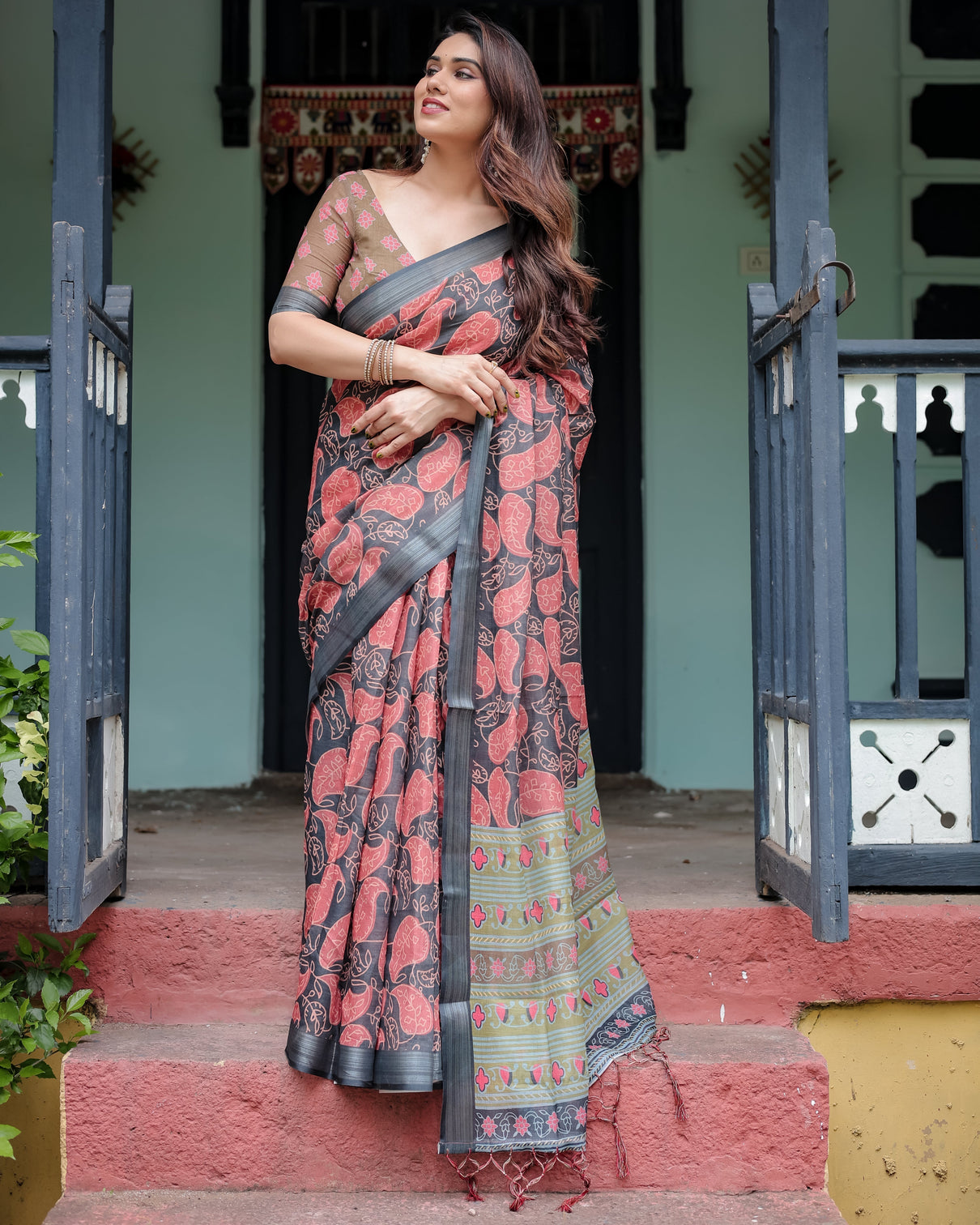 Charcoal black pure cotton linen saree with leafy paisley print blouse and tassel detailing