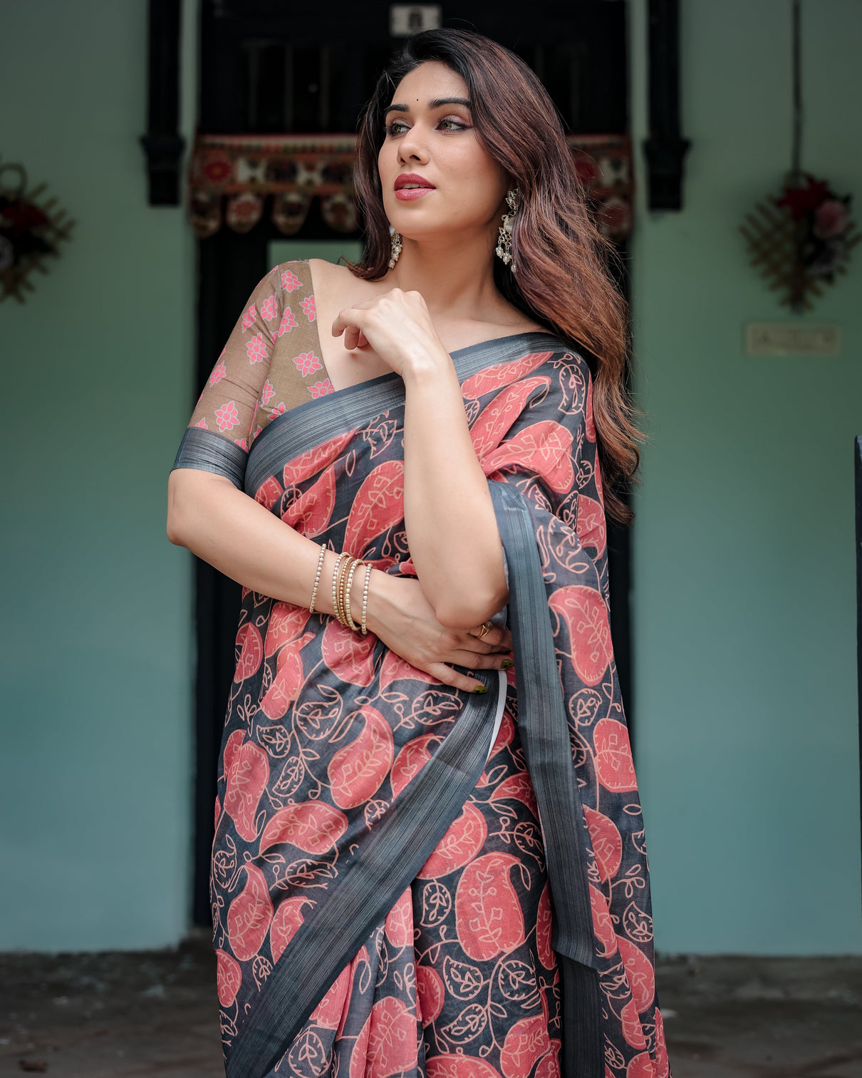 Charcoal black pure cotton linen saree with leafy paisley print blouse and tassel detailing