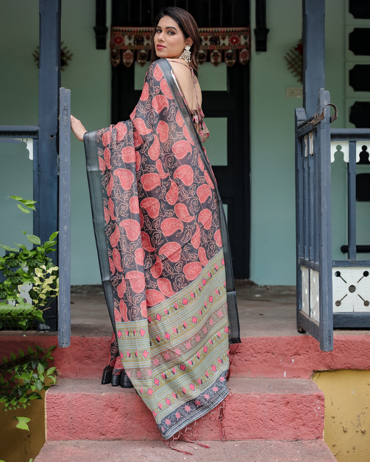 Charcoal black pure cotton linen saree with leafy paisley print blouse and tassel detailing