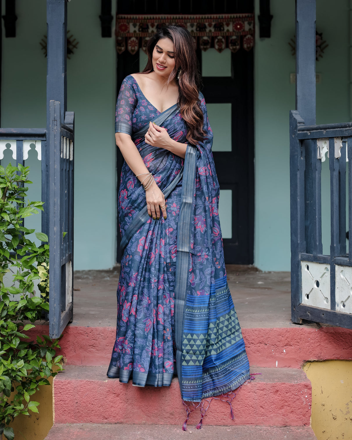 Navy blue pure cotton linen saree with floral print blouse and tassel detailing