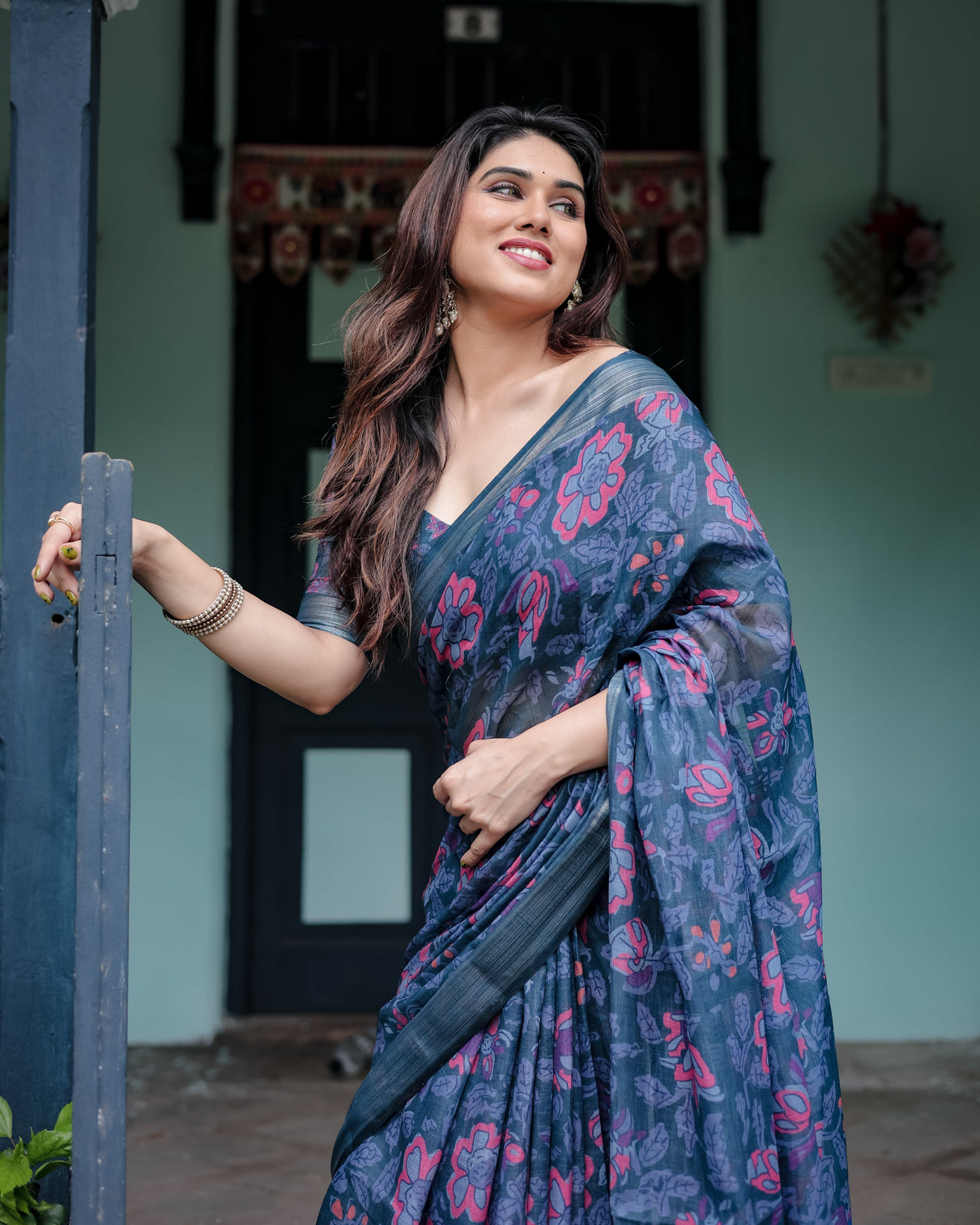Navy blue pure cotton linen saree with floral print blouse and tassel detailing