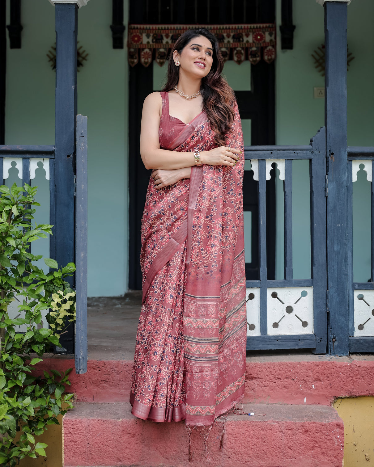 Rust red pure cotton linen saree with floral block print blouse and tassel detailing