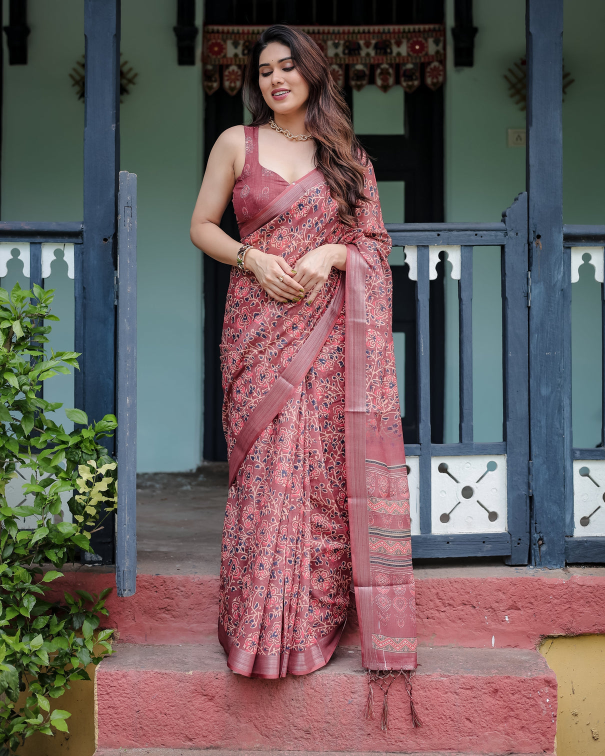 Rust red pure cotton linen saree with floral block print blouse and tassel detailing