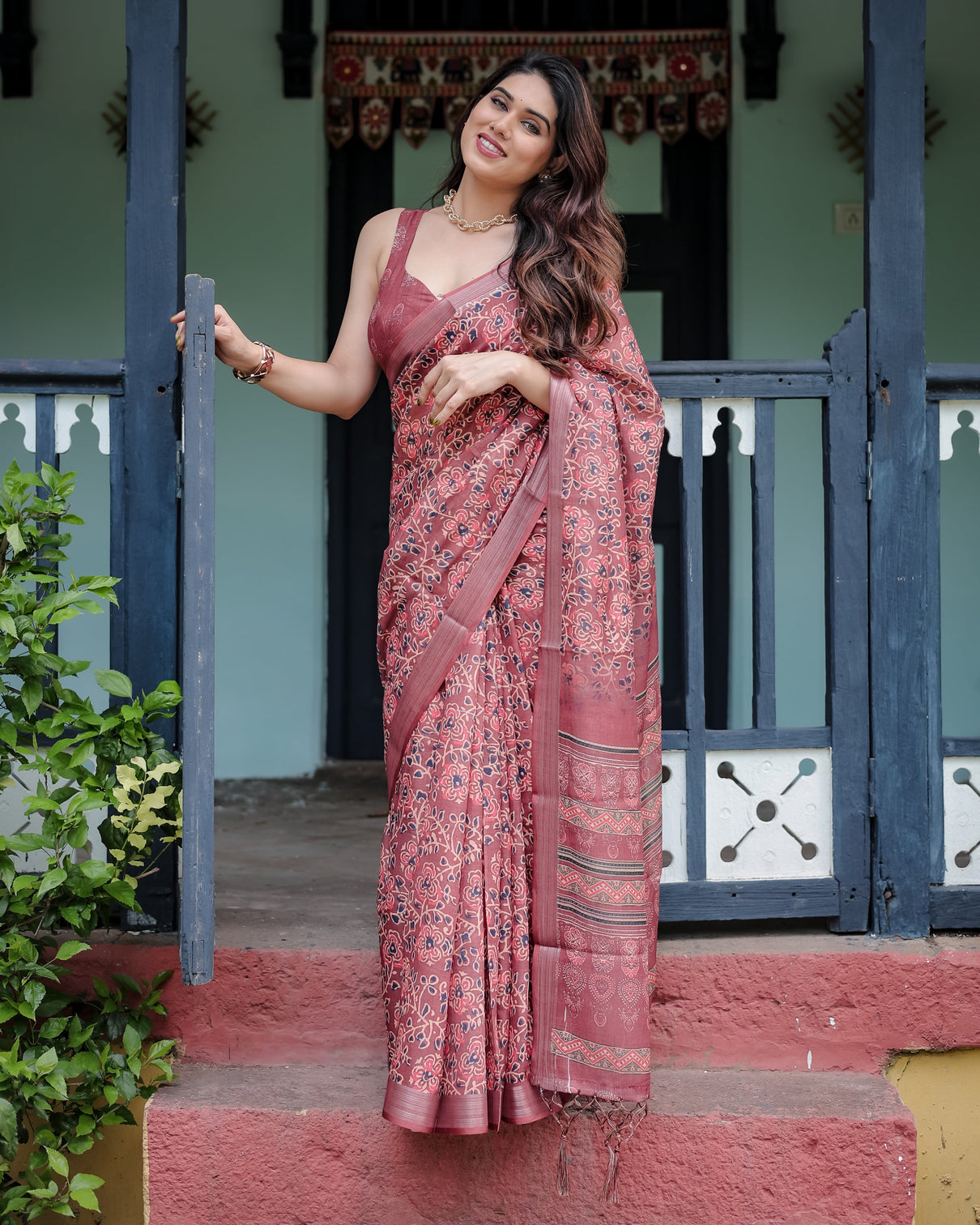 Rust red pure cotton linen saree with floral block print blouse and tassel detailing